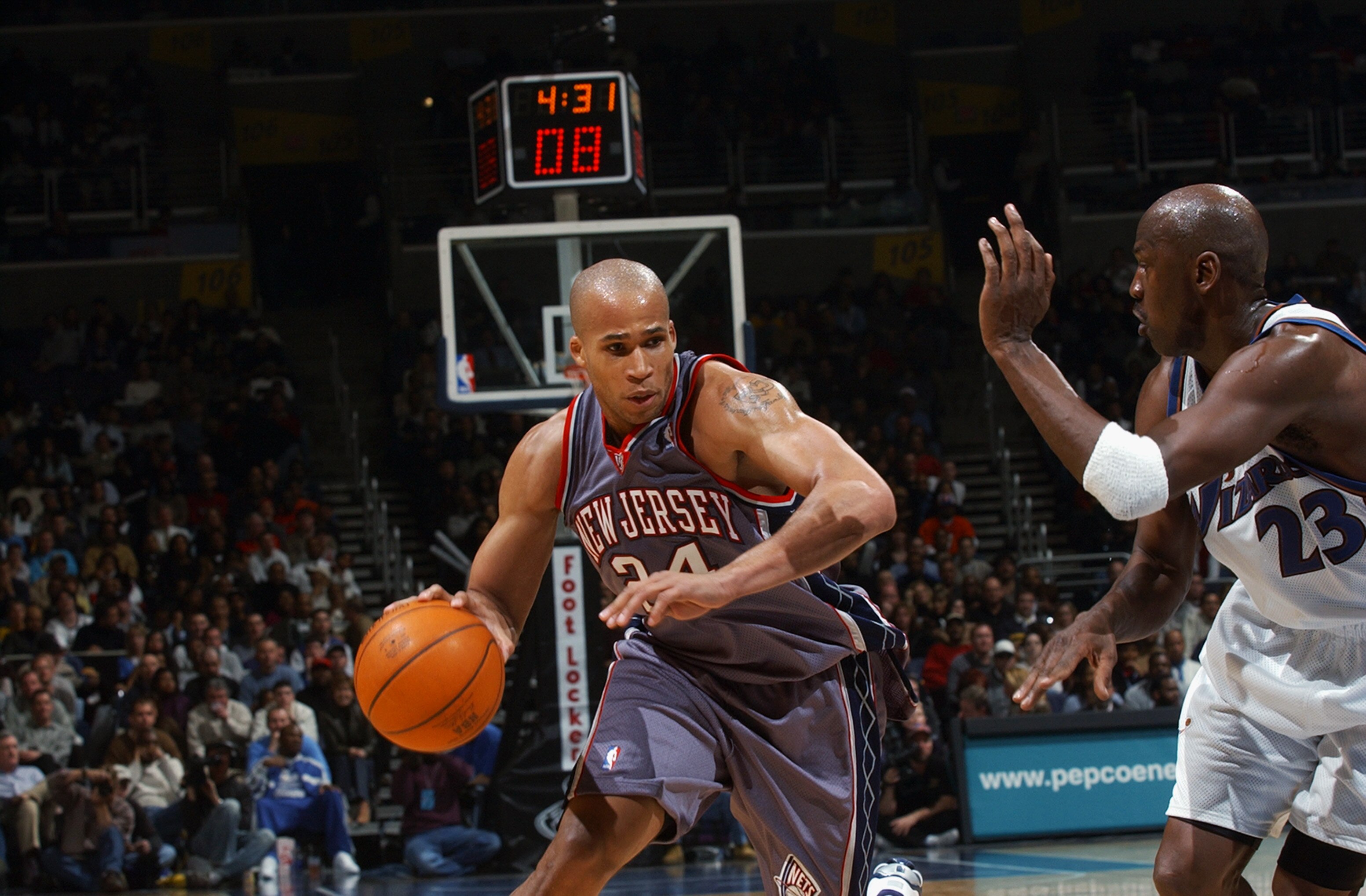 WASHINGTON - FEBRUARY 21:  Richard Jefferson #24 of the New Jersey Nets drives against Michael Jordan #23 of the Washington Wizards during the NBA game at MCI Center on February 21, 2003 in Washington, D.C.  The Wizards won 89-86.  NOTE TO USER: User expr