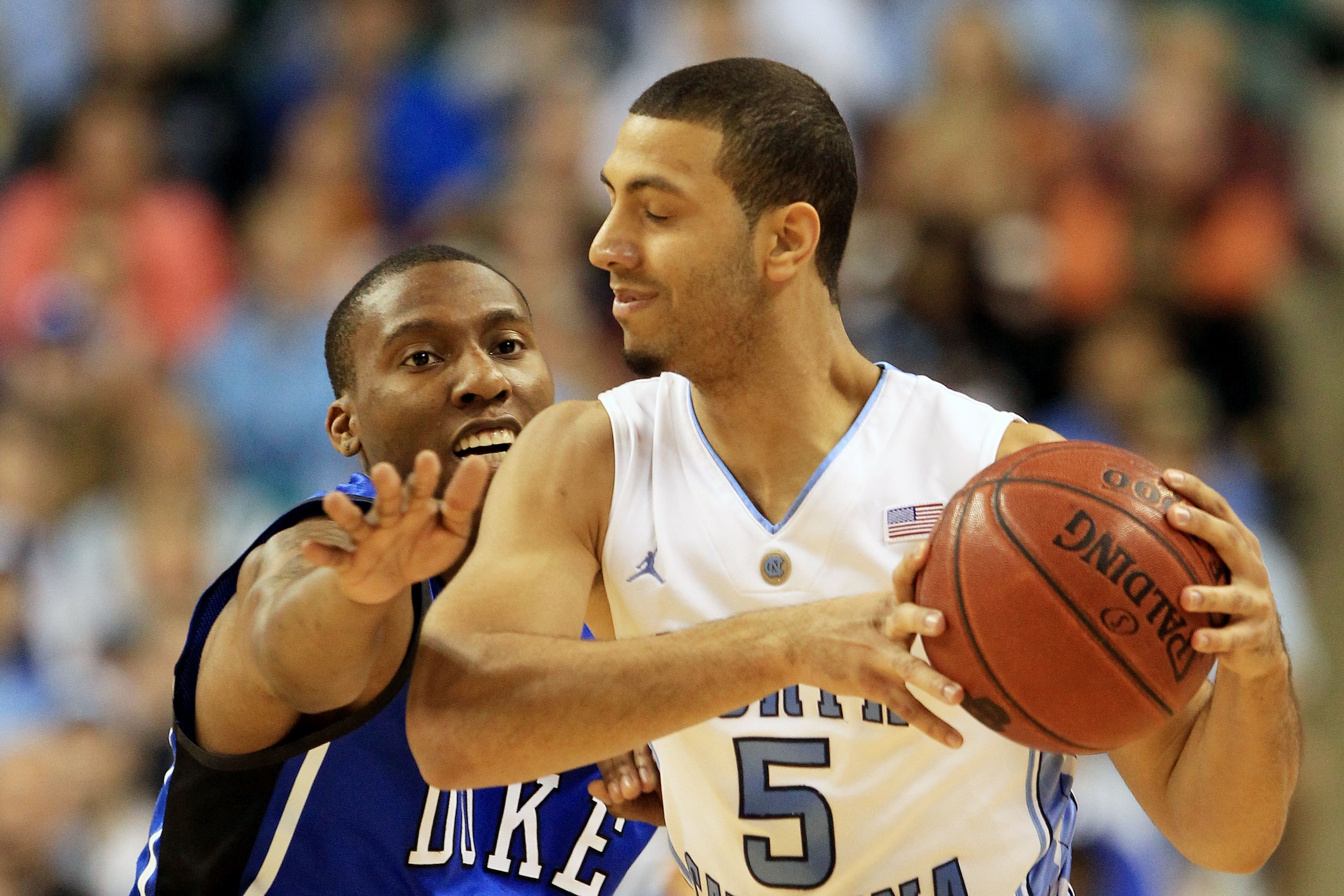 GREENSBORO, NC - MARCH 13:  Kendall Marshall #5 of the North Carolina Tar Heels protects the ball against Nolan Smith #2 of the Duke Blue Devils during the first half in the championship game of the 2011 ACC men's basketball tournament at the Greensboro C