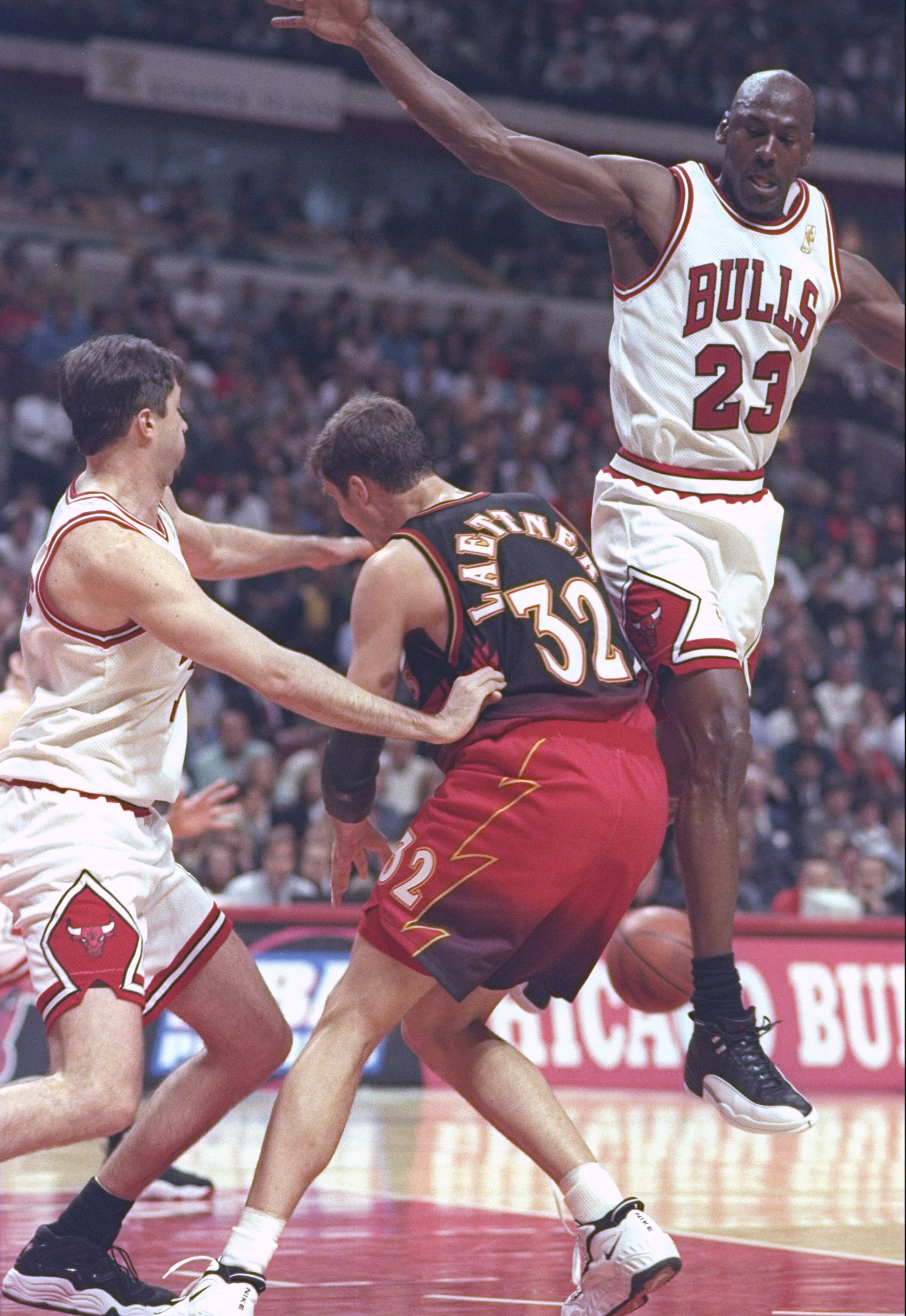 8 May 1997:  Guards Michael Jordan and Toni Kukoc of the Chicago Bulls double team forward Christian Laettner of the Atlanta Hawks during a playoff game at the United Center in Chicago, Illinois.  The Hawks won the game 103-95. Mandatory Credit: Jonathan