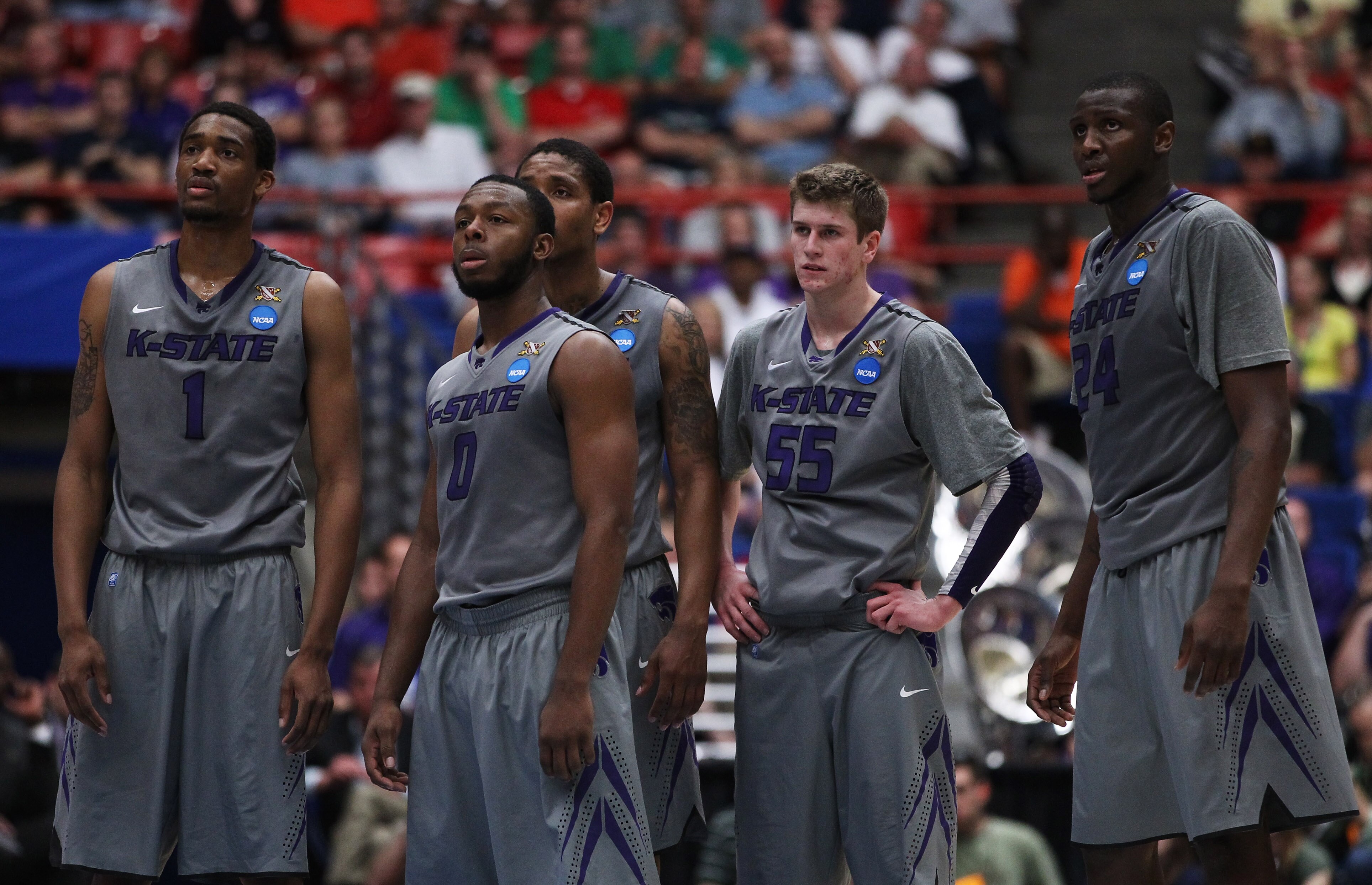 TUCSON, AZ - MARCH 17:  Shane Southwell #1, Jacob Pullen #0, Will Spradling #55, and Curtis Kelly #24 of the Kansas State Wildcats watch as the Utah State Aggies take a free throw for a technical foul during the second round of the 2011 NCAA men's basketb