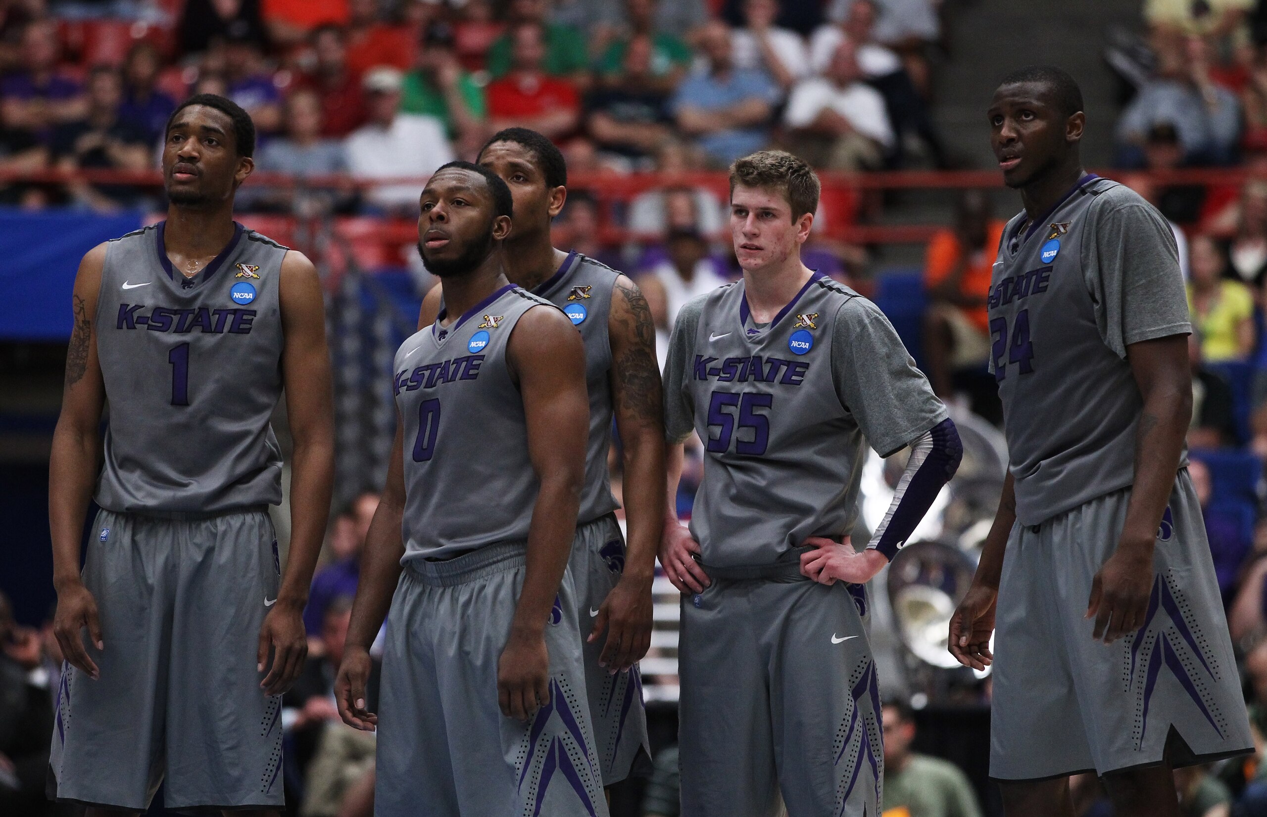 TUCSON, AZ - MARCH 17:  Shane Southwell #1, Jacob Pullen #0, Will Spradling #55, and Curtis Kelly #24 of the Kansas State Wildcats watch as the Utah State Aggies take a free throw for a technical foul during the second round of the 2011 NCAA men's basketb