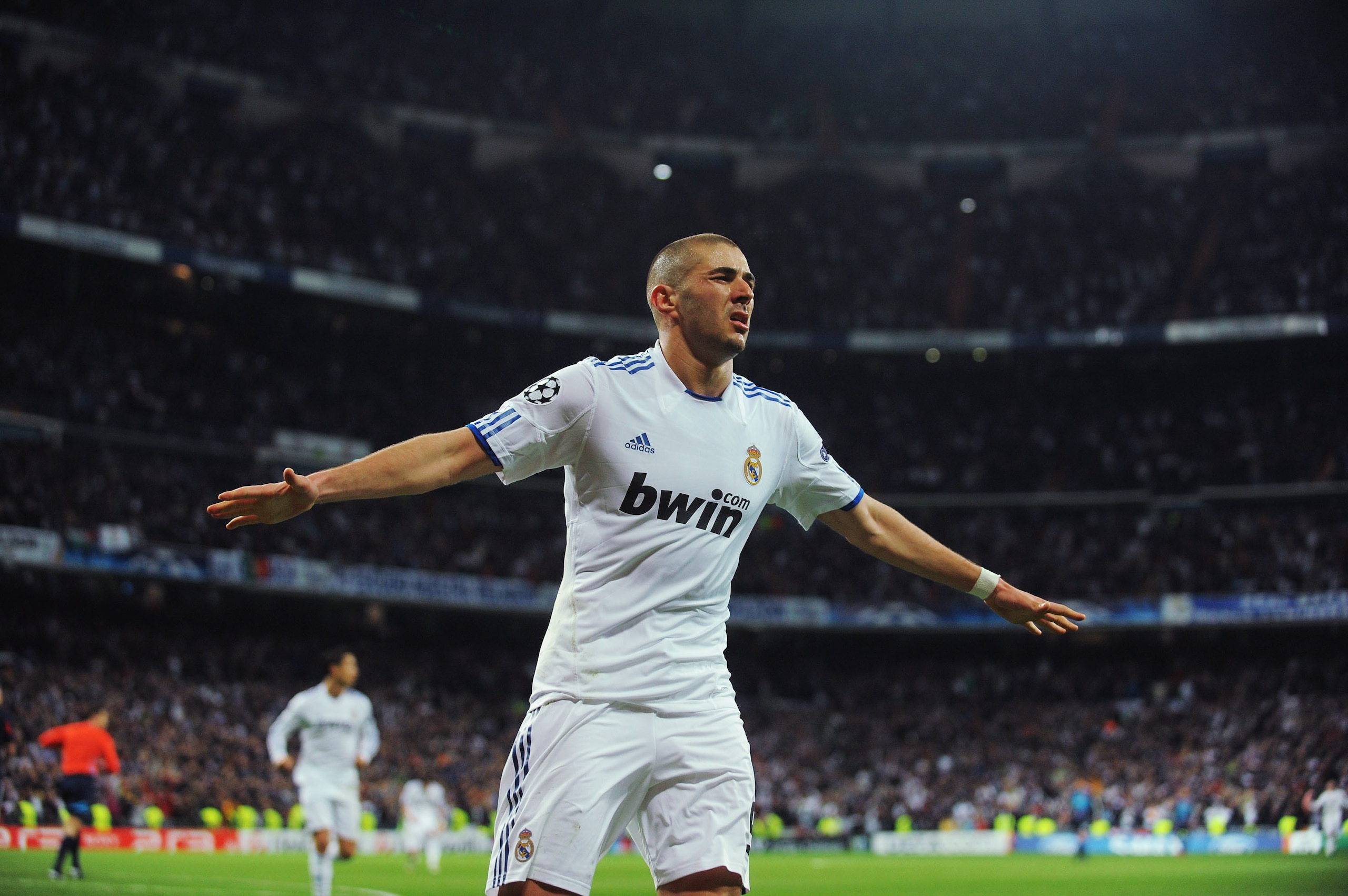 MADRID, SPAIN - MARCH 16: Karim Benzema of Real Madrid celebrates after scoring Real's second goal during the UEFA Champions League round of 16 second leg match between Real Madrid and Lyon at Estadio Santiago Bernabeu on March 16, 2011 in Madrid, Spain. MADRID, SPAIN - MARCH 16: Karim Benzema of Real Madrid celebrates after scoring Real's second goal during the UEFA Champions League round of 16 second leg match between Real Madrid and Lyon at Estadio Santiago Bernabeu on March 16, 2011 in Madrid, Spain.