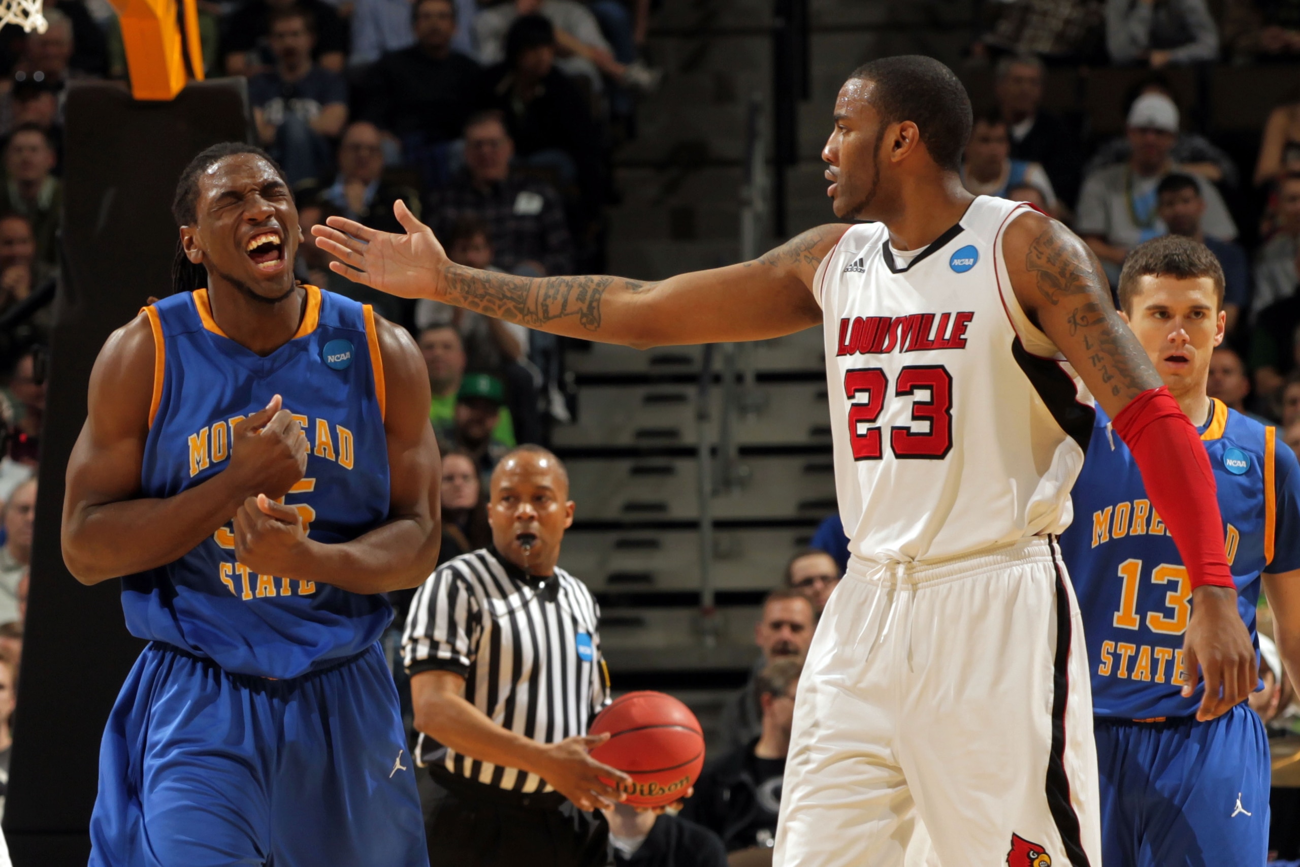 DENVER, CO - MARCH 17:  Kenneth Faried #35 of the Morehead State Eagles reacts after a play as Terrence Jennings #23 of the Louisville Cardinals looks on during the second round of the 2011 NCAA men's basketball tournament at Pepsi Center on March 17, 201