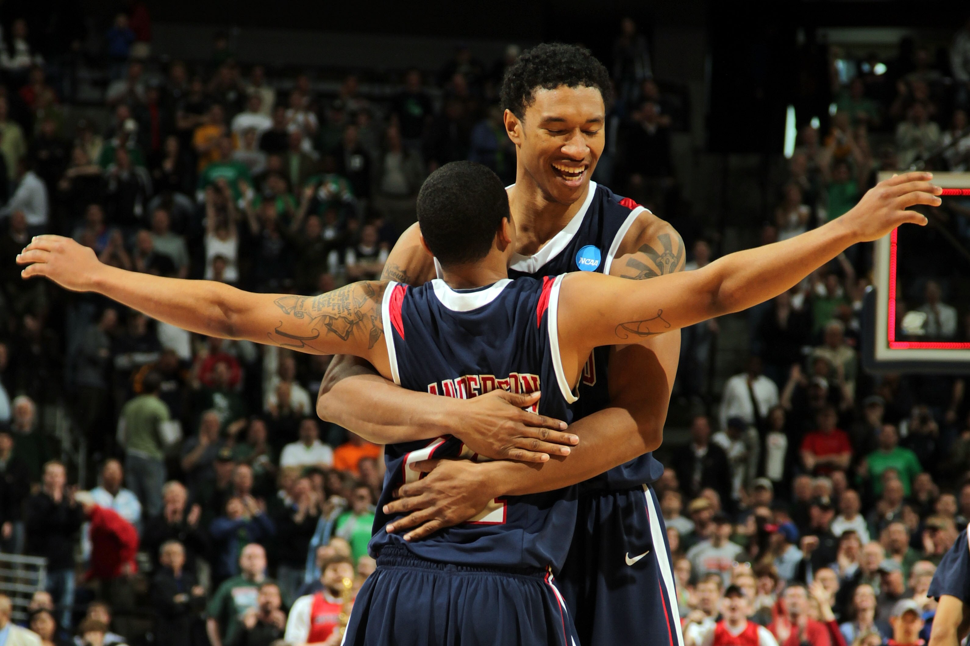 DENVER, CO - MARCH 17:  Kevin Anderson #14 and Justin Harper #32 of the Richmond Spiders celebrate after defeating the Vanderbilt Commodores during the second round of the 2011 NCAA men's basketball tournament at Pepsi Center on March 17, 2011 in Denver,