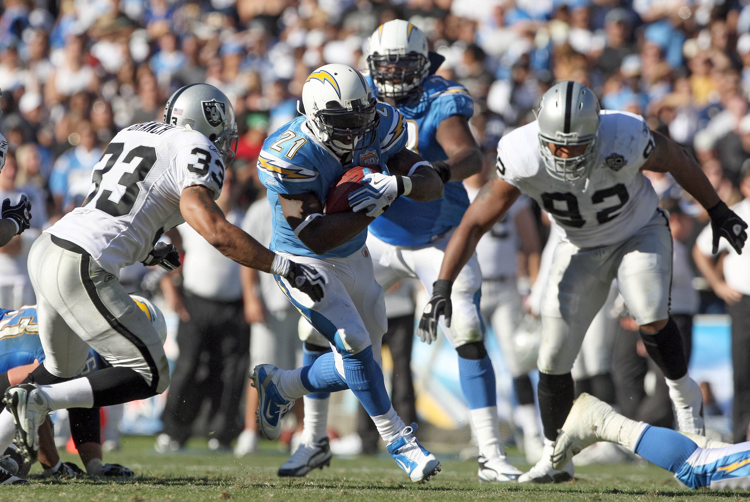 SAN DIEGO, CA - NOVEMBER 1:  Runningback LaDainian Tomlinson #21 of the San Diego Chargers runs for a gain during the game against the Oakland Raiders on November 1, 2009 at Qualcomm Stadium in San Diego, California. (Photo by Donald Miralle/Getty Images)
