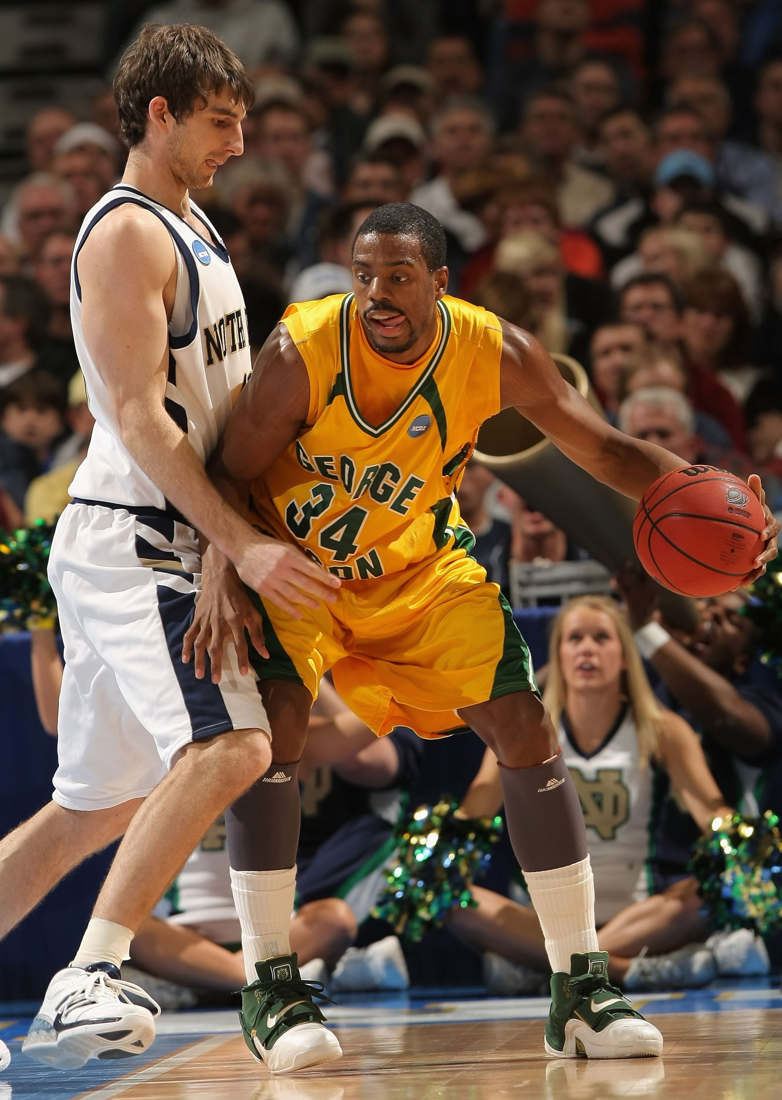 DENVER - MARCH 20:  Will Thomas #34 of the George Mason Patriots handles the ball against the Notre Dame Fighting Irish during the first round of the East Regional as part of the 2008 NCAA Men's Basketball Tournament at Pepsi Center on March 20, 2008 in D