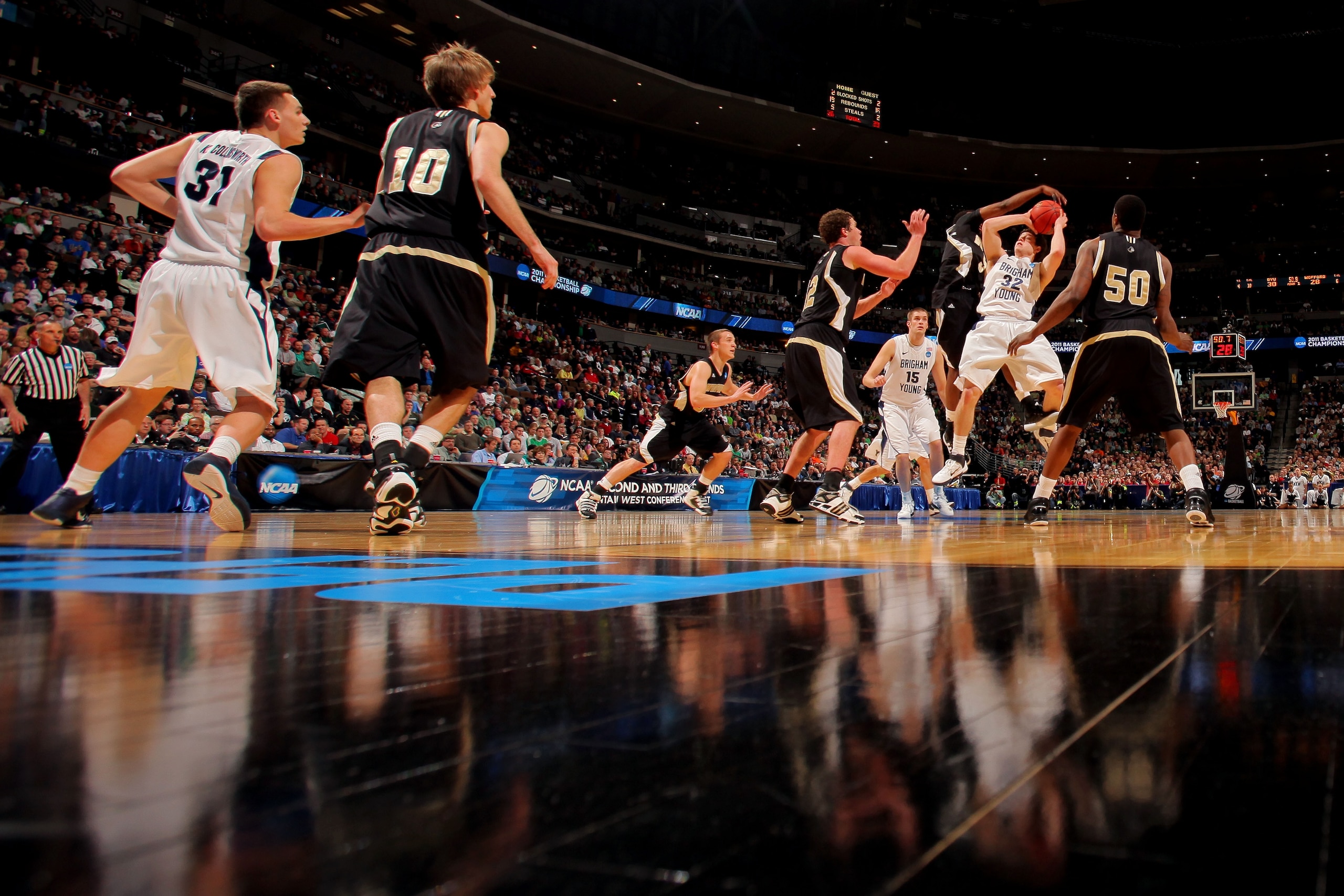 DENVER, CO - MARCH 17: Jimmer Fredette #32 of the Brigham Young Cougars shoots against the Wofford Terriers during the second round of the 2011 NCAA men's basketball tournament at Pepsi Center on March 17, 2011 in Denver, Colorado. (Photo by Doug Pensin DENVER, CO - MARCH 17: Jimmer Fredette #32 of the Brigham Young Cougars shoots against the Wofford Terriers during the second round of the 2011 NCAA men's basketball tournament at Pepsi Center on March 17, 2011 in Denver, Colorado. (Photo by Doug Pensin
