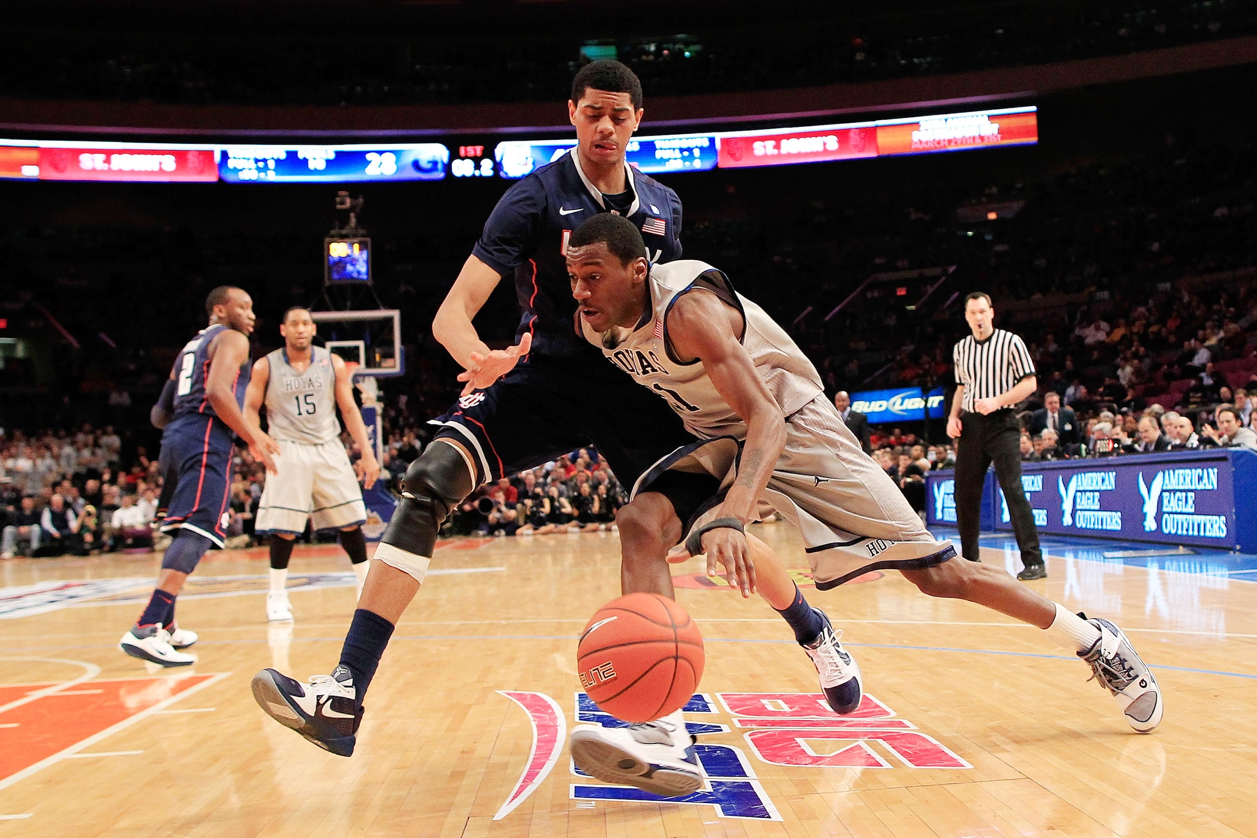 NEW YORK, NY - MARCH 09:  Jason Clark #21 of the Georgetown Hoyas drives against Jeremy Lamb #3 of the Connecticut Huskies during the second round of the 2011 Big East Men's Basketball Tournament presented by American Eagle Outfitters at Madison Square Ga
