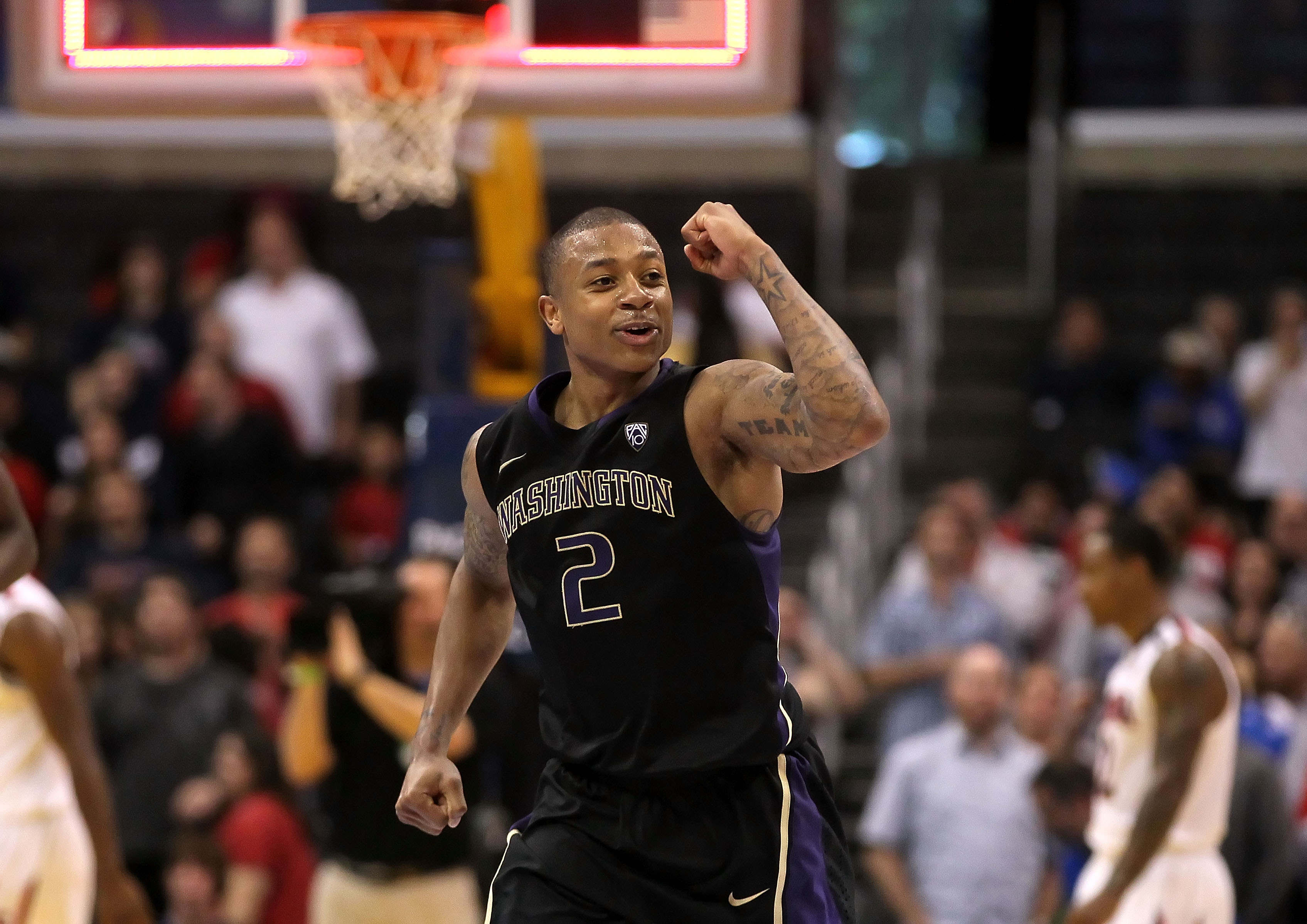 LOS ANGELES, CA - MARCH 12: Isaiah Thomas #2 of the Washington Huskies reacts as the Arizona Wildcats miss a buzzer shot and the game goes into overtime in the championship game of the 2011 Pacific Life Pac-10 Men's Basketball Tournament at Staples Cente