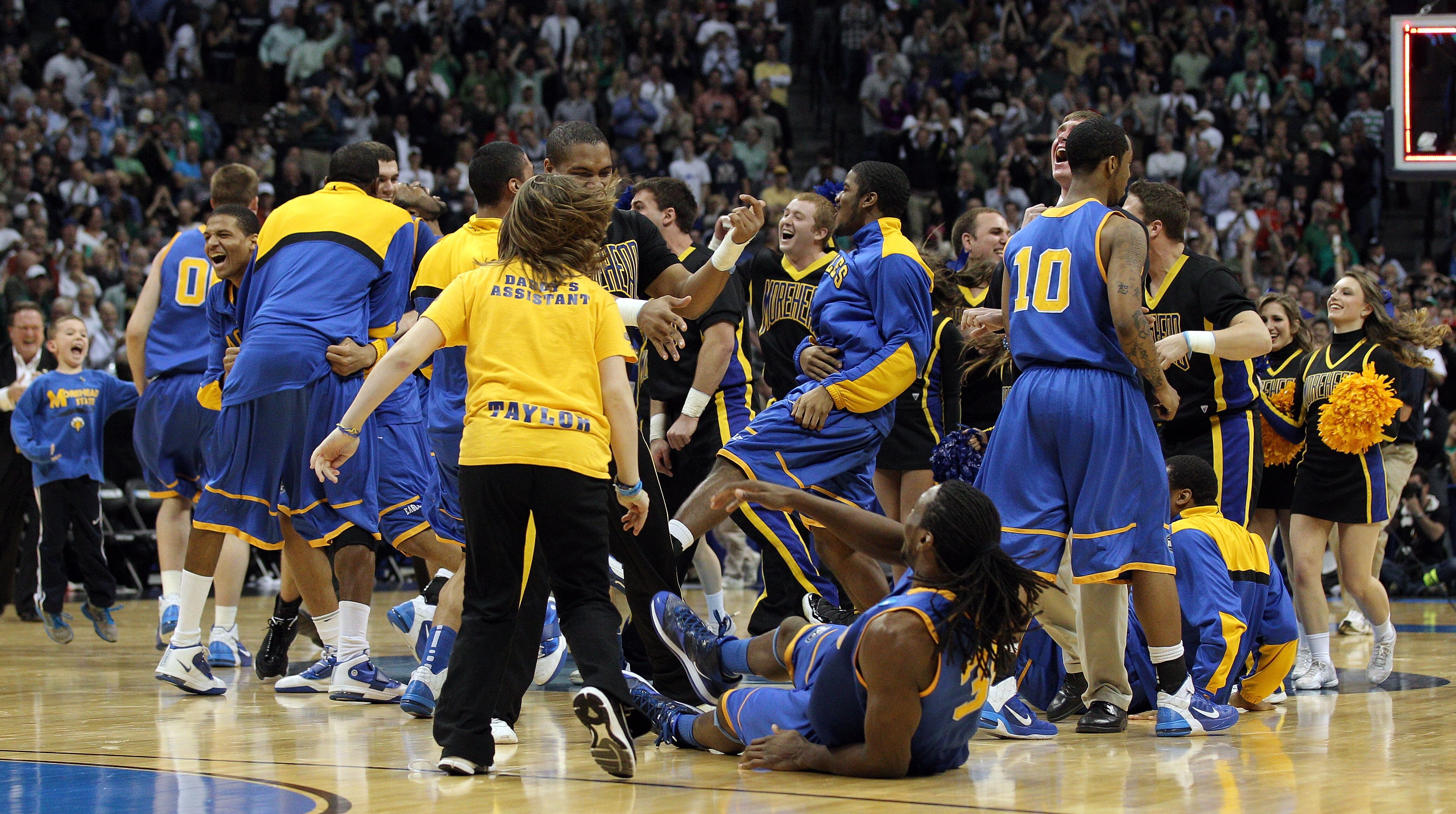 DENVER, CO - MARCH 17:  The Morehead State Eagles celebrate after defeating the Louisville Cardinals during the second round of the 2011 NCAA men's basketball tournament at Pepsi Center on March 17, 2011 in Denver, Colorado. The Morehead State Eagles defe