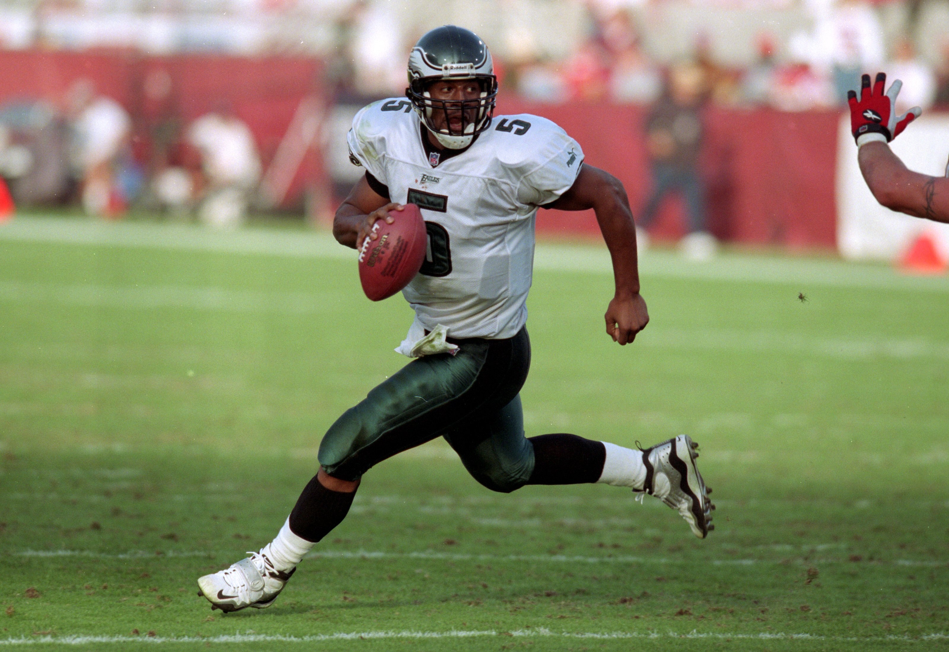 5 Dec 1999: Donovan McNabb #5 of the Philadelphia Eagles runs with the ball during a game against the  Arizona Cardinals at the Sun Devil Stadium in Tempe, Arizona. The Cardinals defeated the Eagles 21-17. Mandatory Credit: Harry How  /Allsport