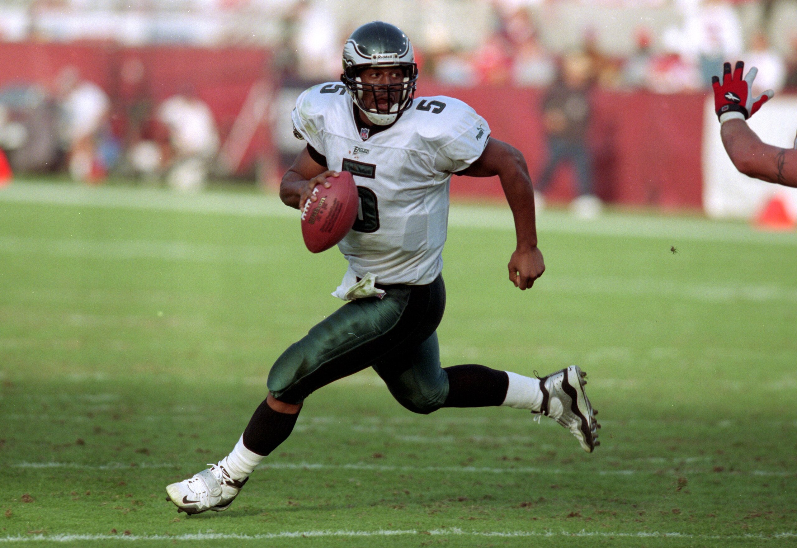 5 Dec 1999: Donovan McNabb #5 of the Philadelphia Eagles runs with the ball during a game against the  Arizona Cardinals at the Sun Devil Stadium in Tempe, Arizona. The Cardinals defeated the Eagles 21-17. Mandatory Credit: Harry How  /Allsport