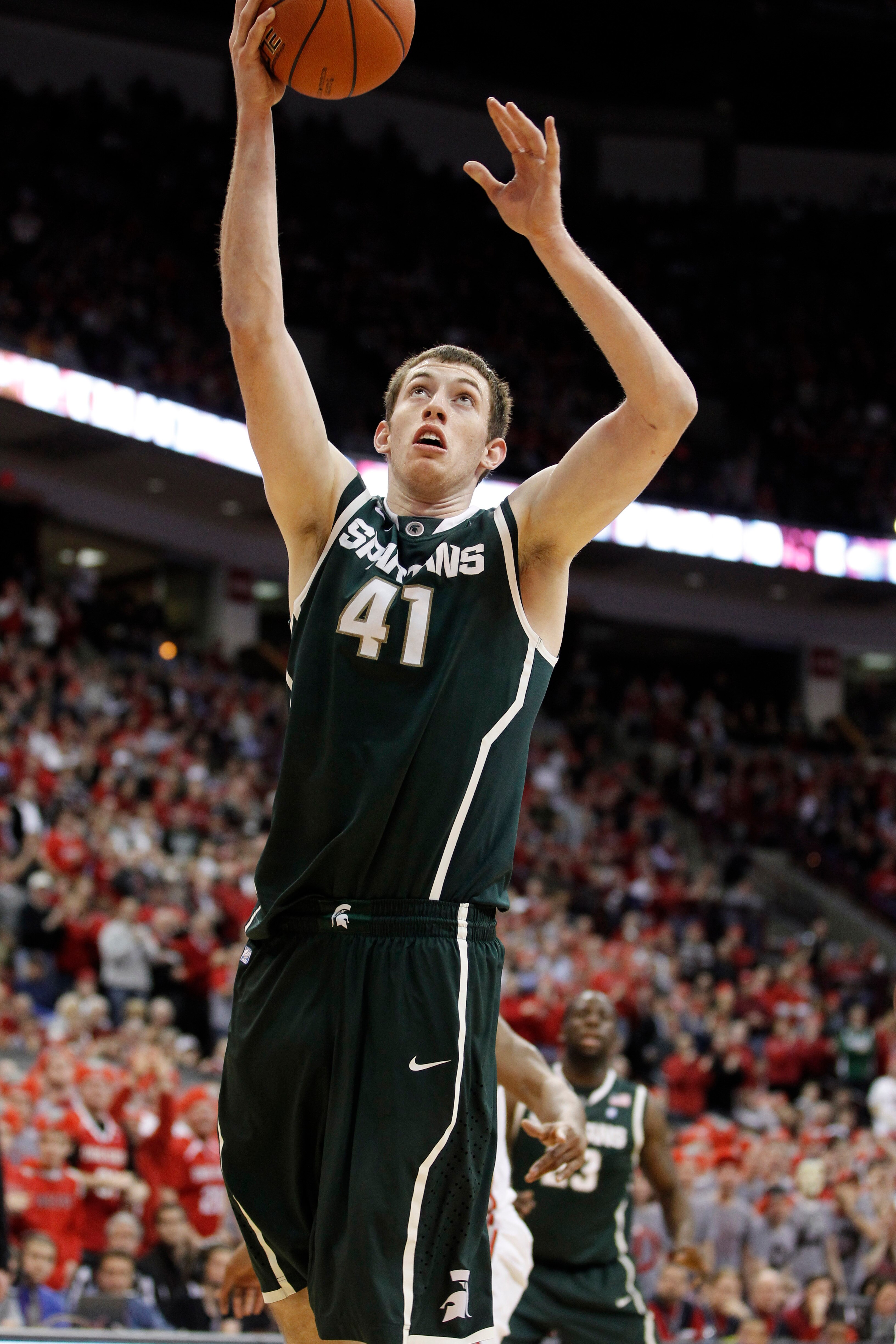 COLUMBUS, OH - FEBRUARY 15:  Garrick Sherman #41 of the Michigan State Spartans gets a shot off while playing the Ohio State Buckeyes on February 15, 2011 at Value City Arena in Columbus, Ohio.  (Photo by Gregory Shamus/Getty Images)