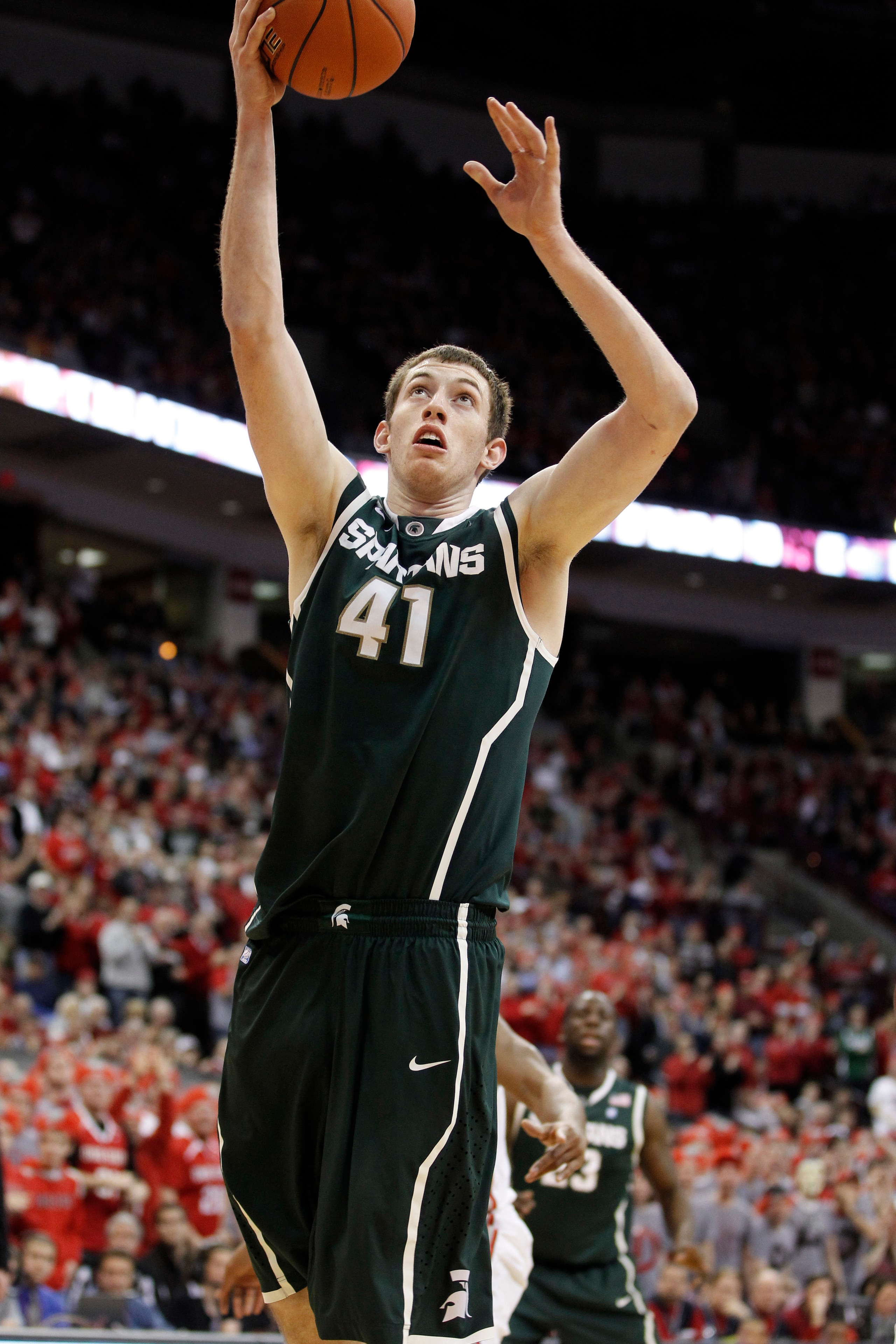 COLUMBUS, OH - FEBRUARY 15:  Garrick Sherman #41 of the Michigan State Spartans gets a shot off while playing the Ohio State Buckeyes on February 15, 2011 at Value City Arena in Columbus, Ohio.  (Photo by Gregory Shamus/Getty Images)