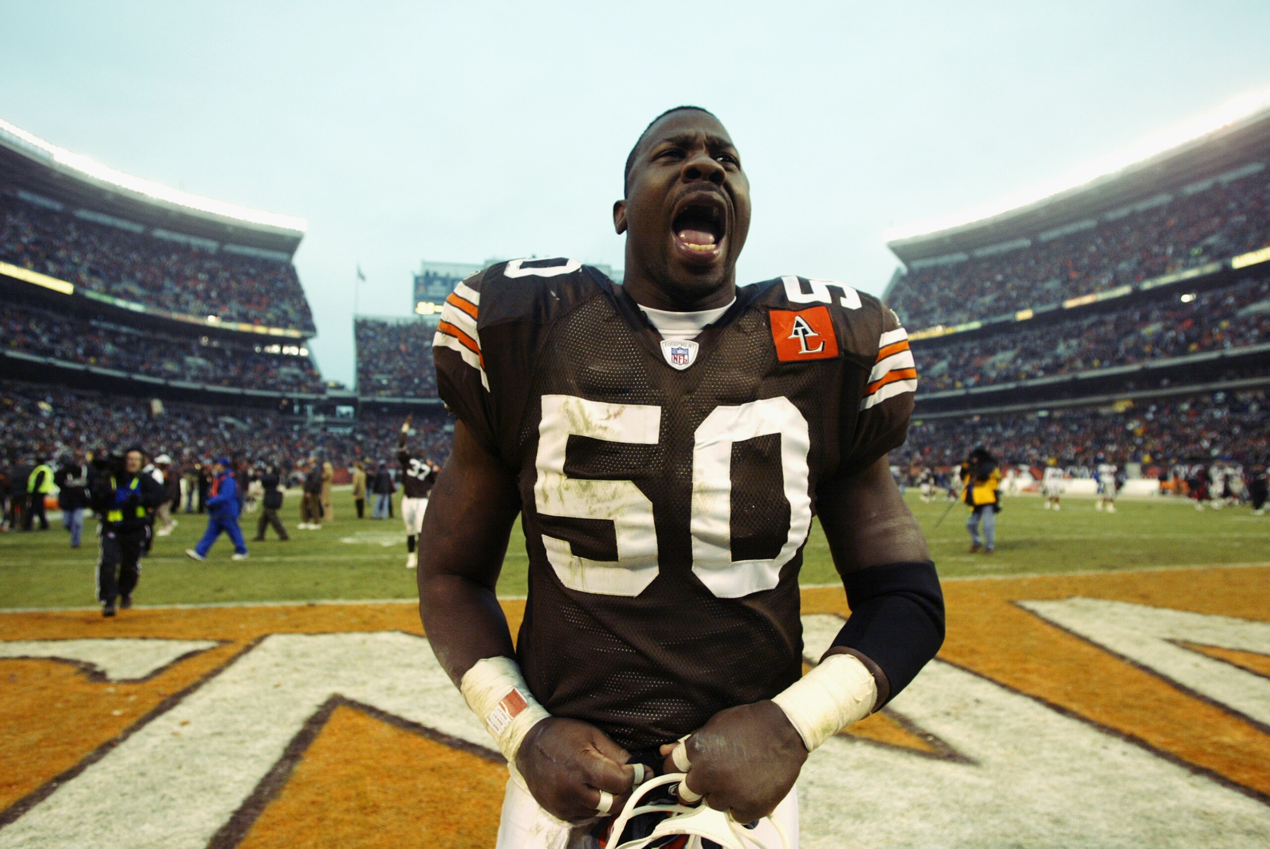 CLEVELAND - DECEMBER 29:  Linebacker Earl Holmes #50 of the Cleveland Browns celebrates after defeating the Atlanta Falcons during the NFL game at Cleveland Browns Stadium on December 29, 2002 in Cleveland, Ohio.  The Browns defeated the Falcons 24-16.  (