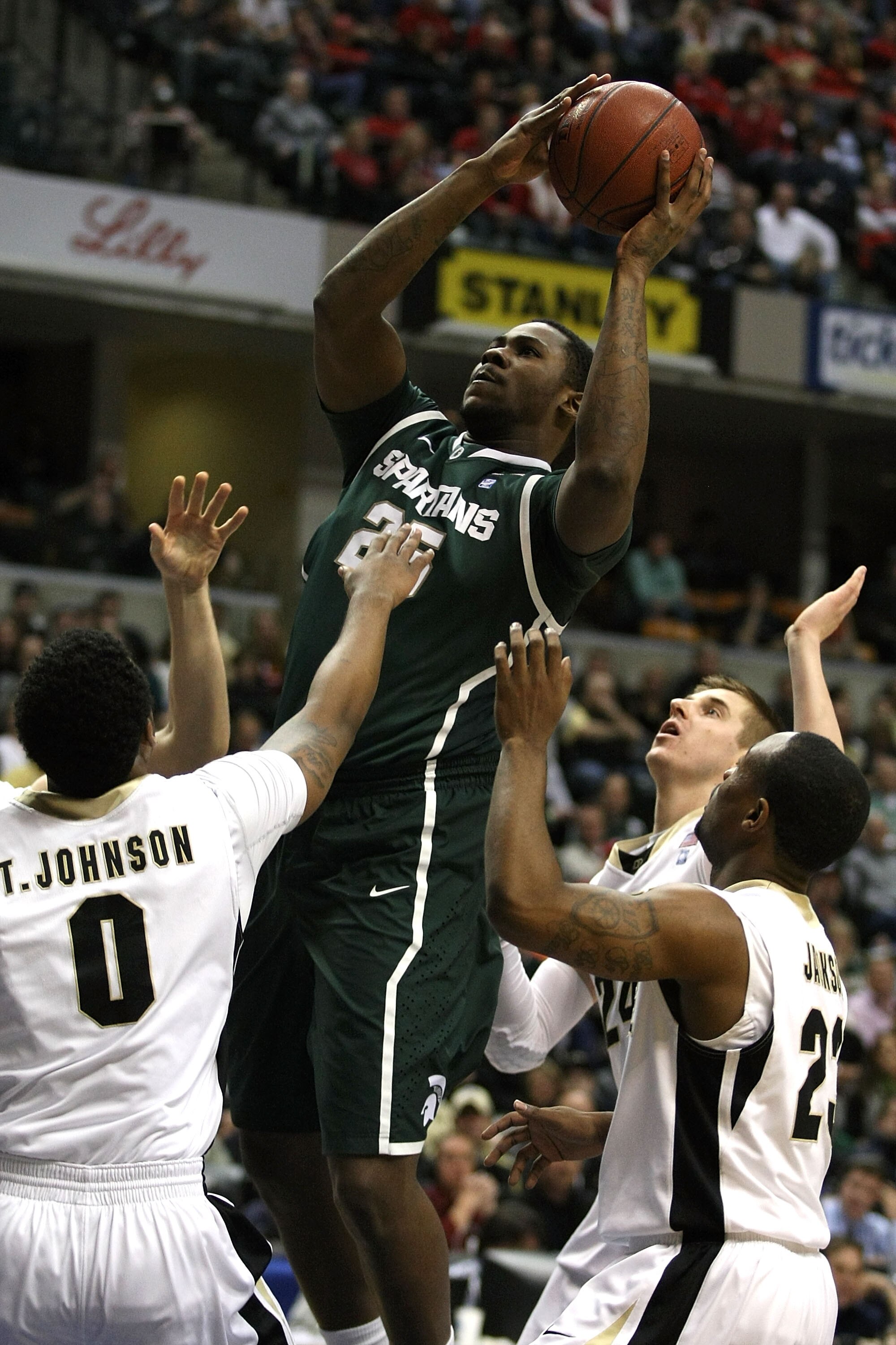 INDIANAPOLIS, IN - MARCH 11:  Derrick Nix #25 of the Michigan State Spartans attempts a shot in the first half against the Purdue Boilermakers during the quarterfinals of the 2011 Big Ten Men's Basketball Tournament at Conseco Fieldhouse on March 11, 2011