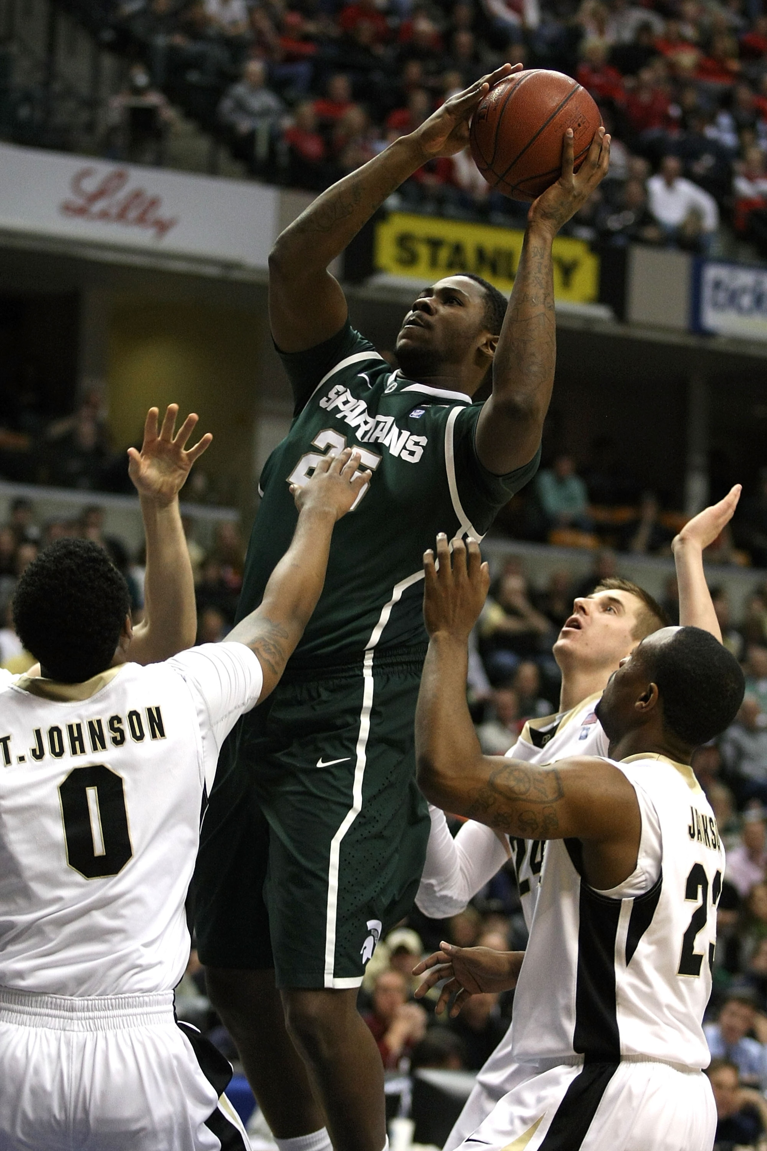 INDIANAPOLIS, IN - MARCH 11:  Derrick Nix #25 of the Michigan State Spartans attempts a shot in the first half against the Purdue Boilermakers during the quarterfinals of the 2011 Big Ten Men's Basketball Tournament at Conseco Fieldhouse on March 11, 2011