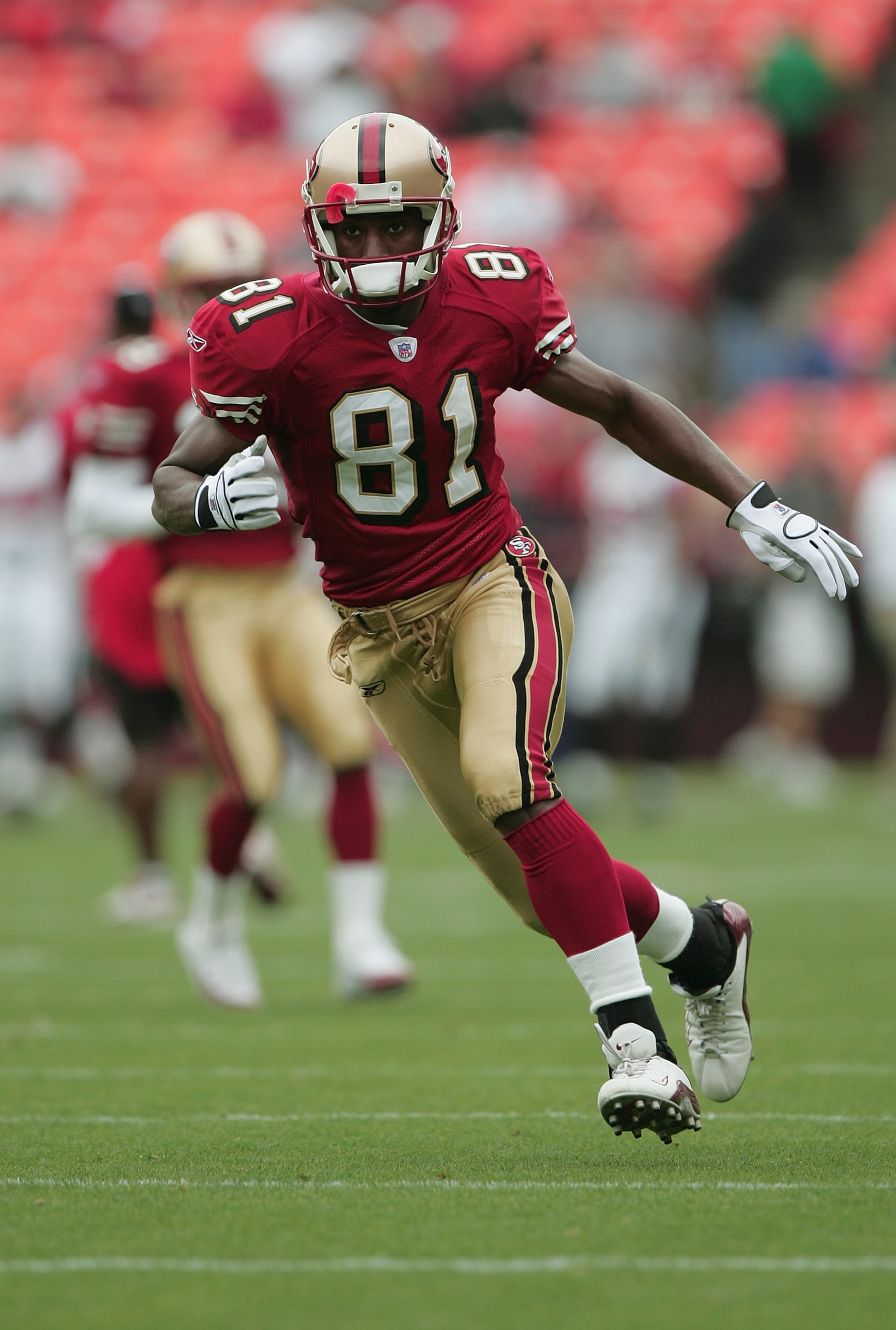 SAN FRANCISCO - SEPTEMBER 12:  Wide receiver Rashaun Woods #81 of the San Francisco 49ers carries the ball against the Atlanta Falcons during the game at 3Com Park on September 12, 2004 in San Francisco, California. The Falcons won 21-19.  (Photo by Jed J