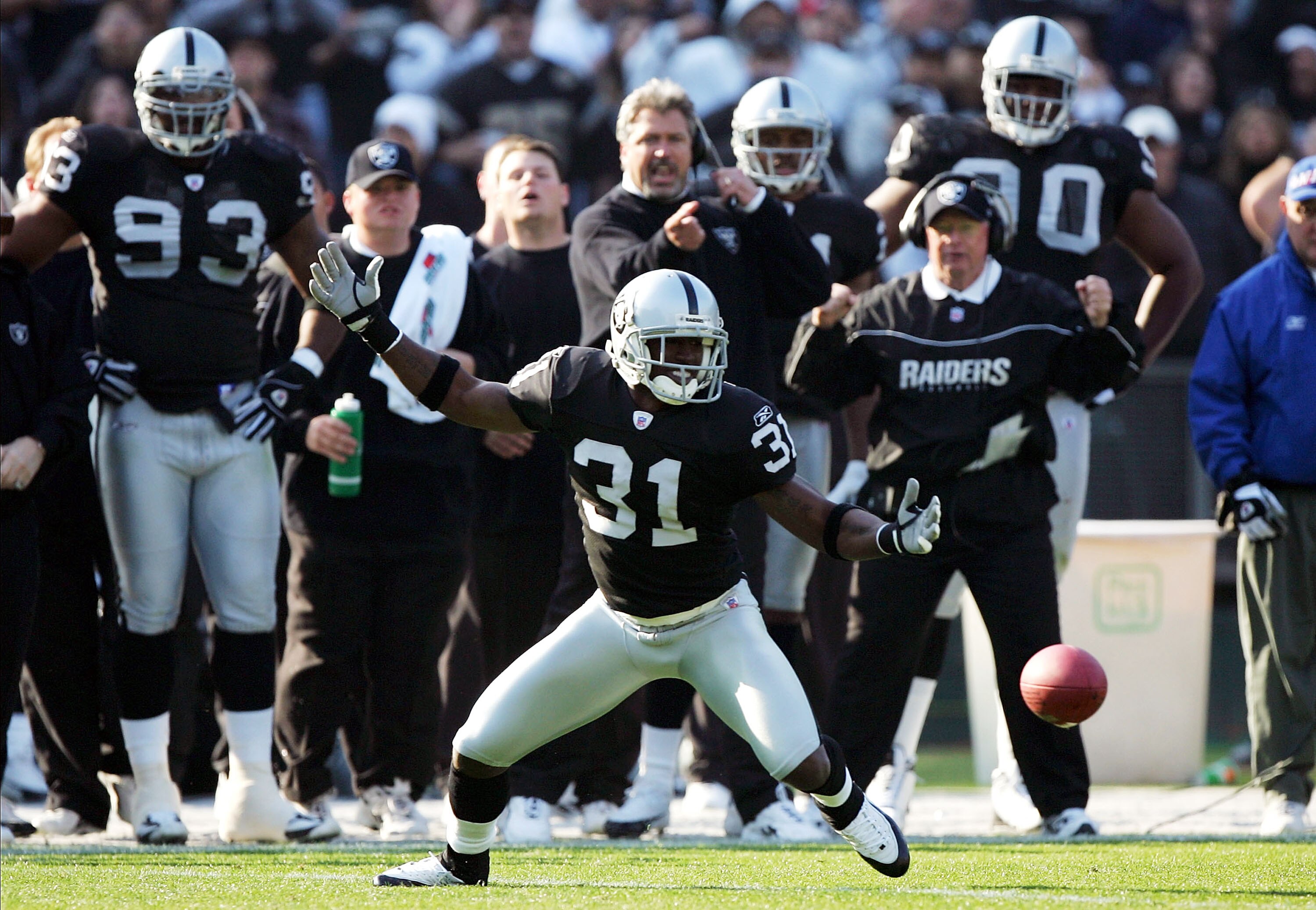 OAKLAND, CA - DECEMBER 5:  Phillip Buchanon #31 of the Oakland Raiders fumbles an interception against the Kansas City Chiefs at Network Associates Coliseum on December 5, 2004 in Oakland, California.  (Photo by Jed Jacobsohn/Getty Images)
