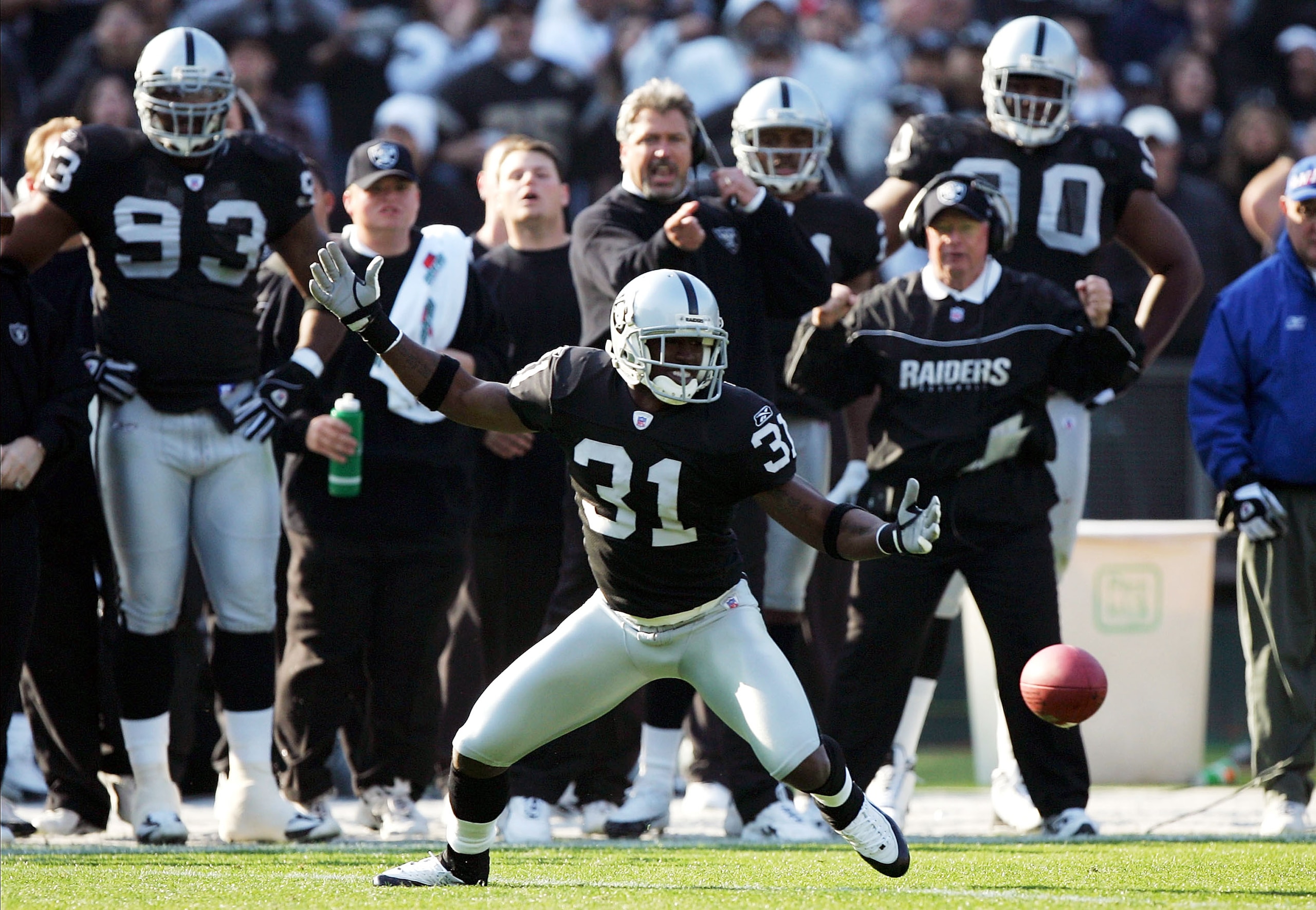 OAKLAND, CA - DECEMBER 5:  Phillip Buchanon #31 of the Oakland Raiders fumbles an interception against the Kansas City Chiefs at Network Associates Coliseum on December 5, 2004 in Oakland, California.  (Photo by Jed Jacobsohn/Getty Images)