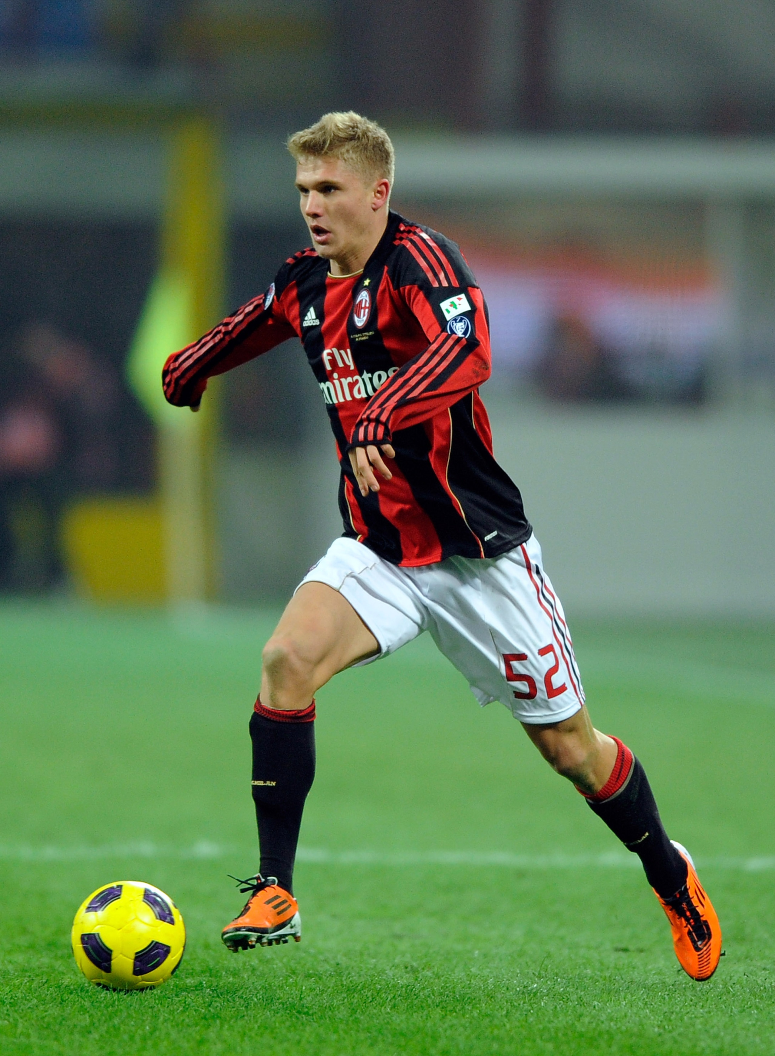MILAN, ITALY - JANUARY 20:  Alexander Merkel of AC Milan goes for the ball during the Tim Cup match between Milan and Bari at Giuseppe Meazza Stadium on January 20, 2011 in Milan, Italy.  (Photo by Claudio Villa/Getty Images)