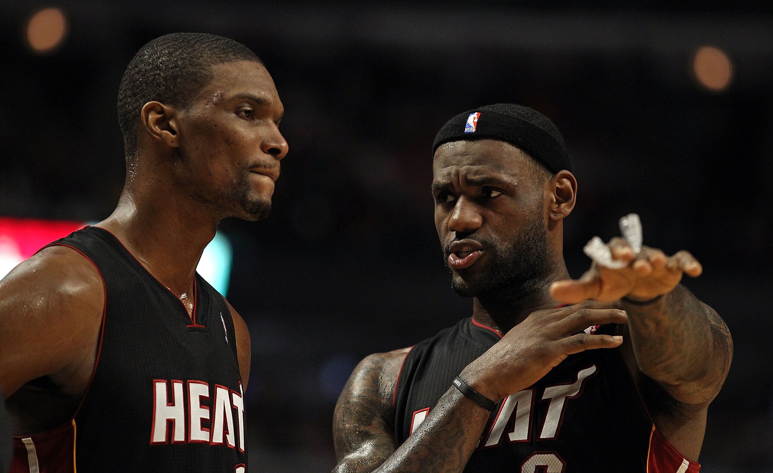 CHICAGO, IL - FEBRUARY 24: LeBron James #6 of the Miami Heat (R) talks with teammate Chris Bosh #1 during a game against the Chicago Bulls at the United Center on February 24, 2011 in Chicago, Illinois. The Bulls defeated the Heat 93-89. NOTE TO USER: Use