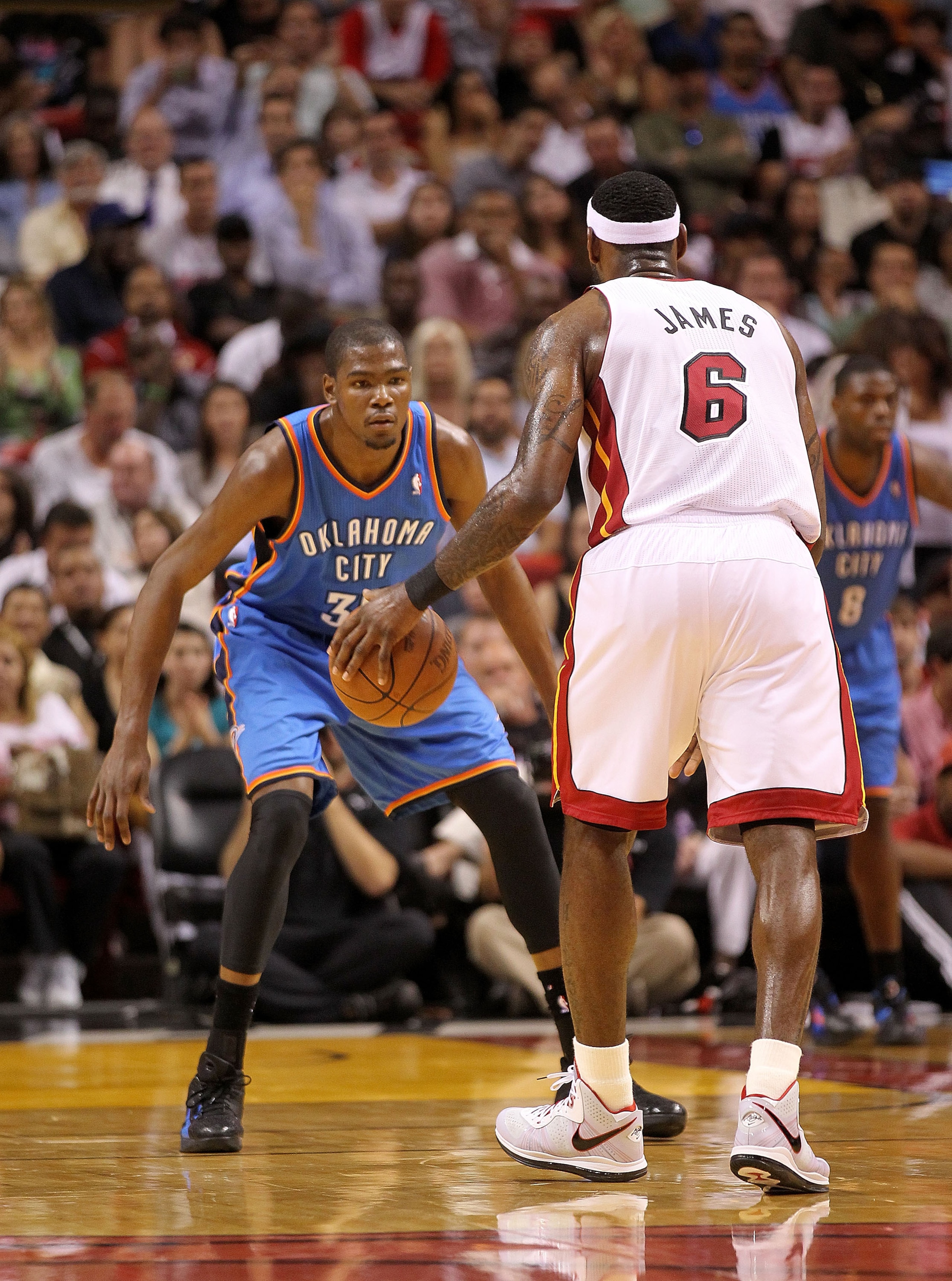 MIAMI, FL - MARCH 16: LeBron James #6 of the Miami Heat is guarded by Kevin Durant #35 of the Oklahoma City Thunder during a game at American Airlines Arena on March 16, 2011 in Miami, Florida. NOTE TO USER: User expressly acknowledges and agrees that, by