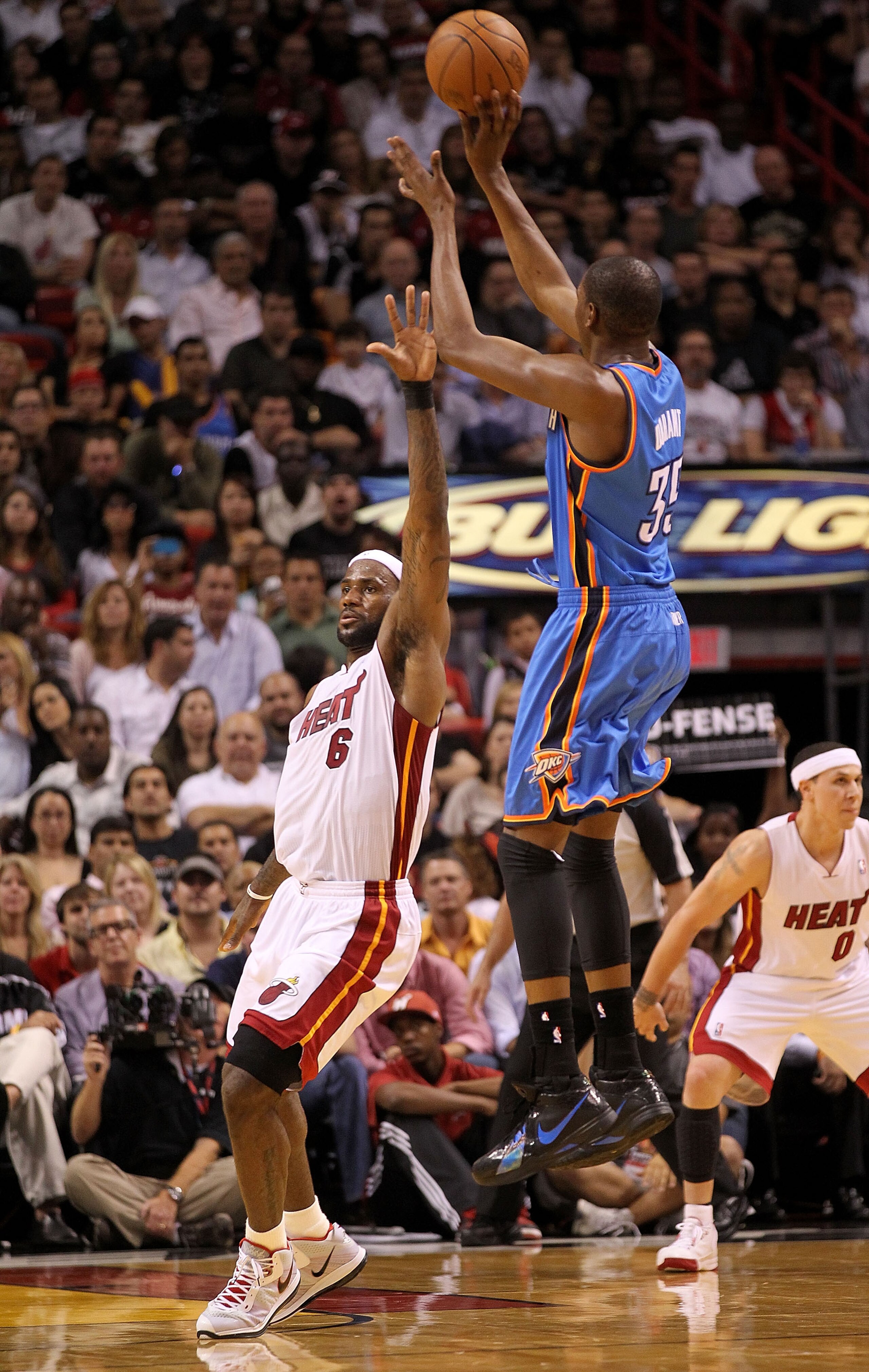 MIAMI, FL - MARCH 16:  Kevin Durant #35  of the the Oklahoma City Thunder shoots over LeBron James #6 of the Miami Heat during a game at American Airlines Arena on March 16, 2011 in Miami, Florida. NOTE TO USER: User expressly acknowledges and agrees that