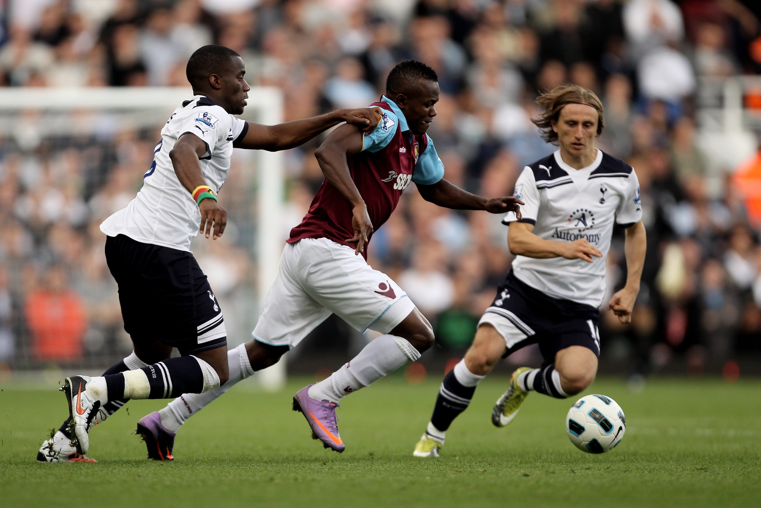 LONDON, ENGLAND - SEPTEMBER 25:  Victor Obinna of West Ham  is challenged by Sebastien Bassong  (L) and Luka Modric of Spurs during the Barclays Premier League match between West Ham United and Tottenham Hotspur at the Boleyn Ground on September 25, 2010