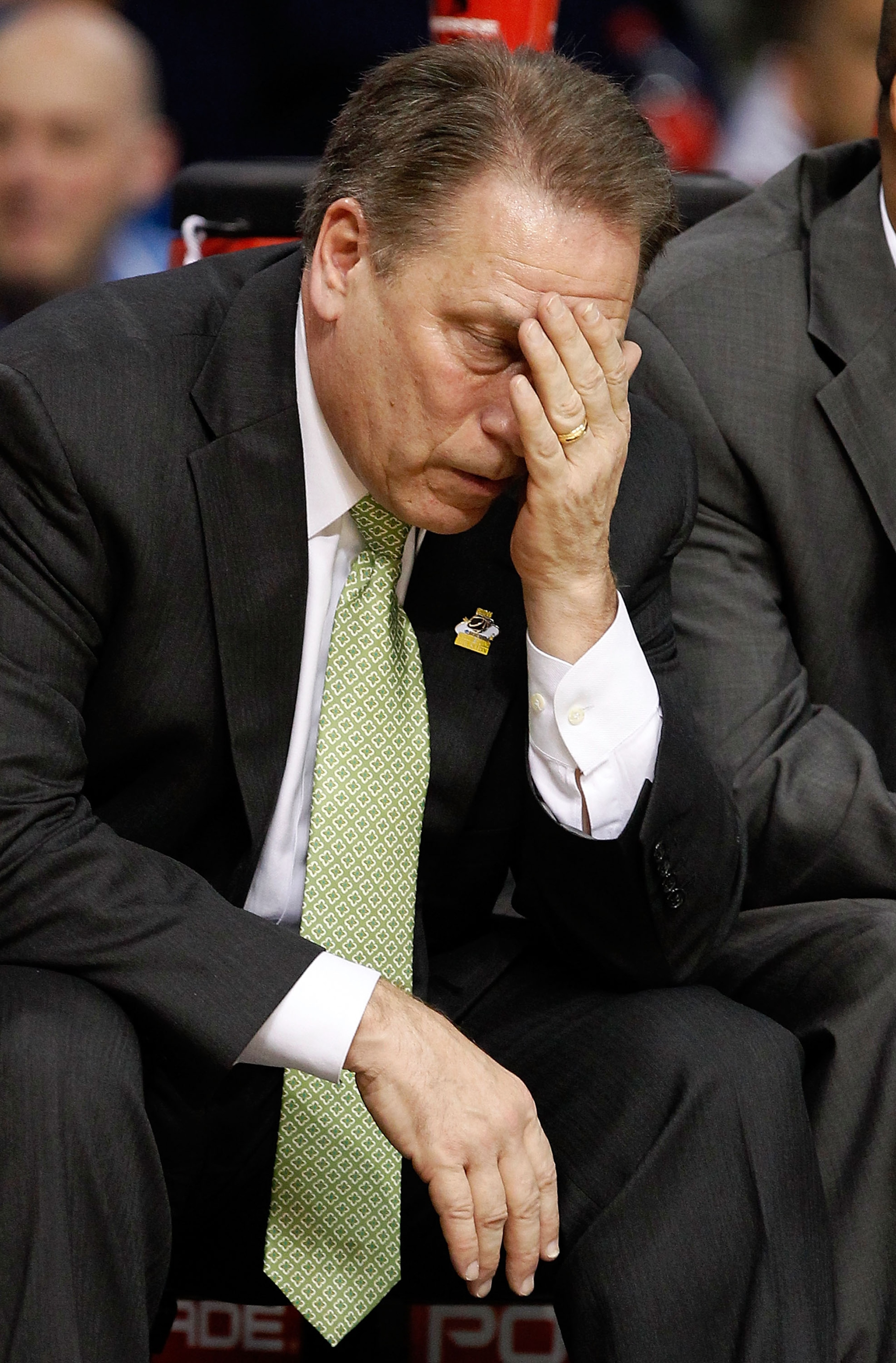 TAMPA, FL - MARCH 17:  Head coach Tom Izzo of the Michigan State Spartans covers his face on the bench against during the second round of the 2011 NCAA men's basketball tournament at St. Pete Times Forum on March 17, 2011 in Tampa, Florida.  (Photo by J. 