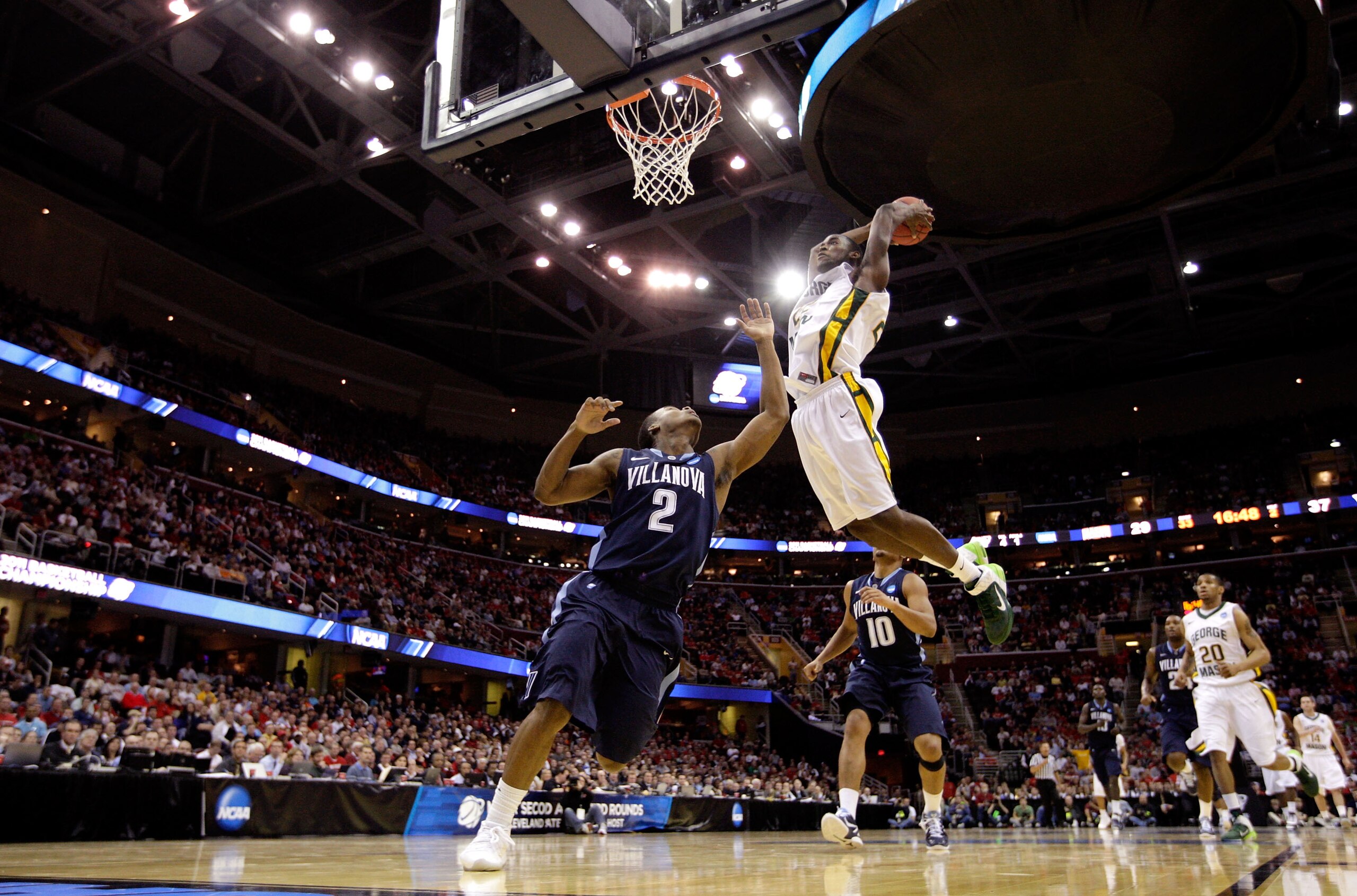 CLEVELAND, OH - MARCH 18: Mike Morrison #22 of the George Mason Patriots dunks over Maalik Wayns #2 of the Villanova Wildcats during the second round of the 2011 NCAA men's basketball tournament at Quicken Loans Arena on March 18, 2011 in Cleveland, Ohio. CLEVELAND, OH - MARCH 18: Mike Morrison #22 of the George Mason Patriots dunks over Maalik Wayns #2 of the Villanova Wildcats during the second round of the 2011 NCAA men's basketball tournament at Quicken Loans Arena on March 18, 2011 in Cleveland, Ohio.