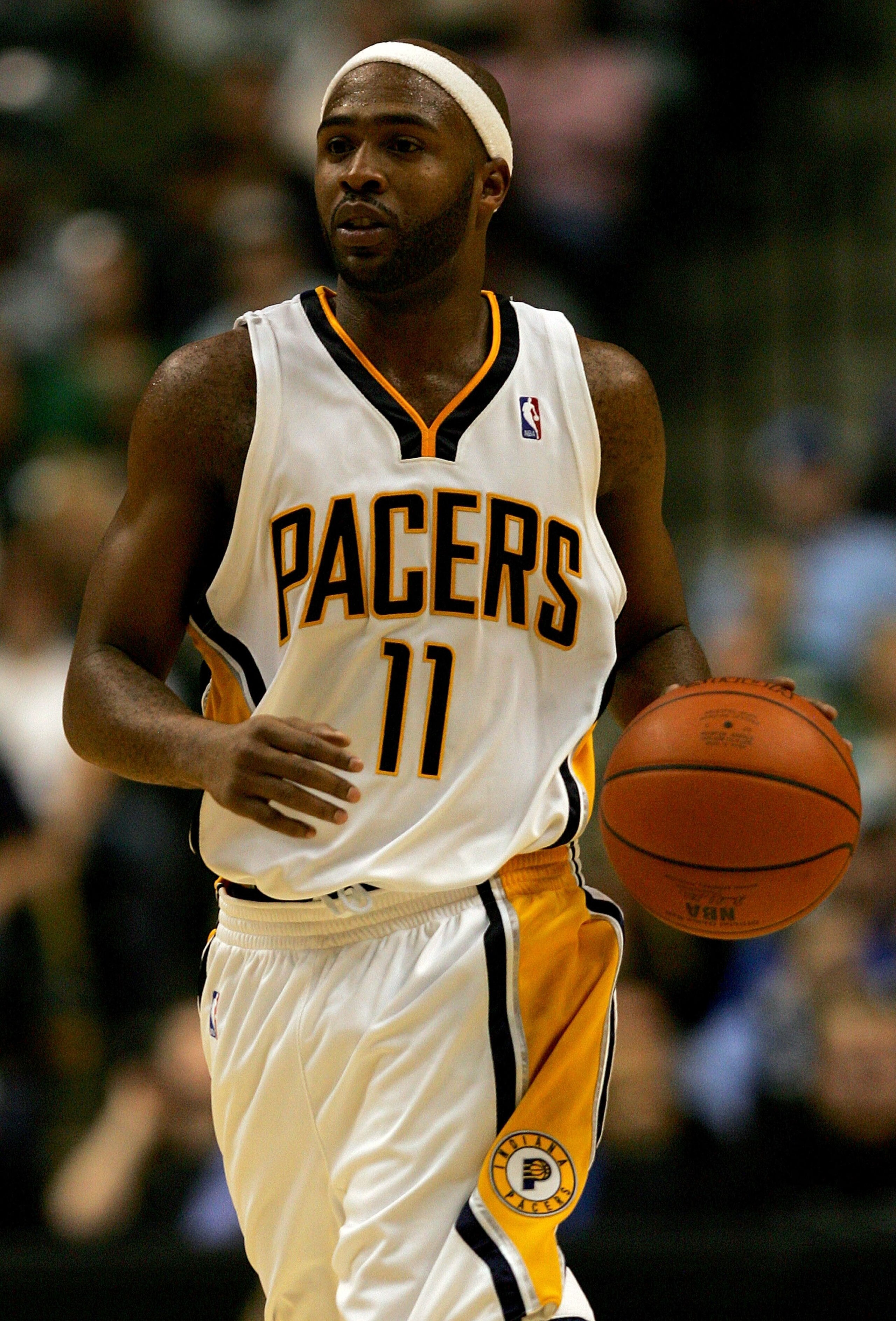 INDIANAPOLIS - OCTOBER 31: Jamaal Tinsley #11 of the Indiana Pacers brings the ball down court against the Washington Wizards October 31, 2007 at Conseco Fieldhouse in Indianapolis, Indiana.  NOTE TO USER: User expressly acknowledges and agrees that, by d