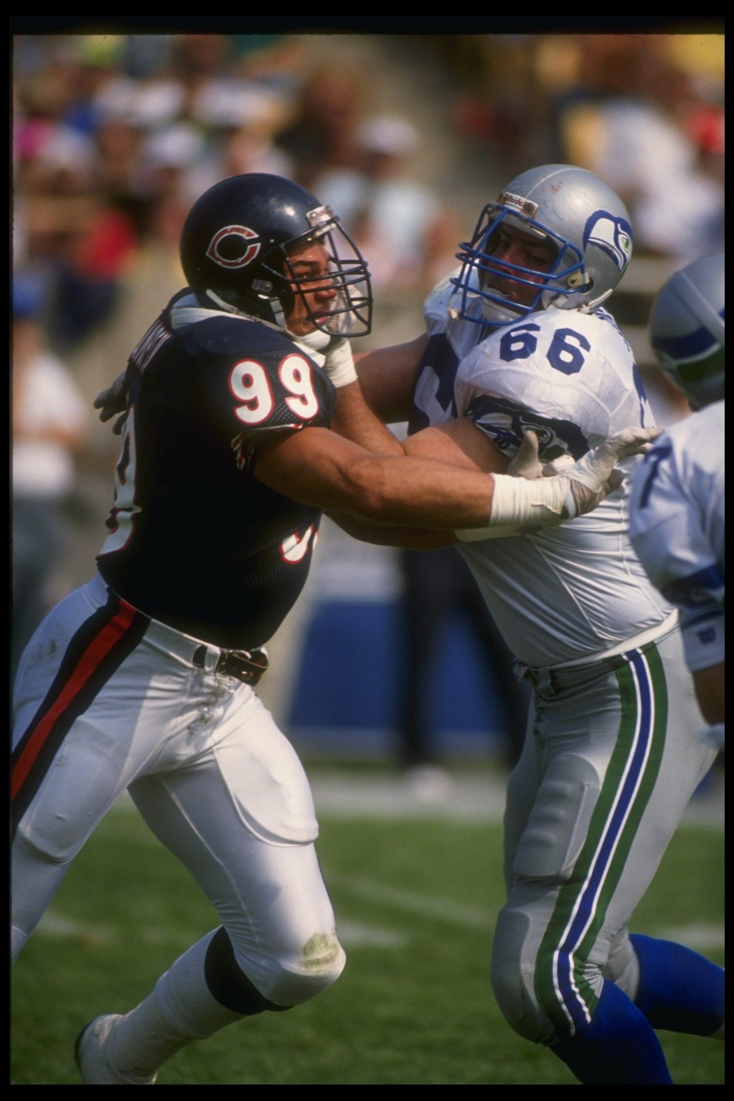 9 Sep 1990: Defensive lineman Dan Hampton of the Chicago Bears (left) and offensive lineman Andy Heck of the Seattle Seahawks tangle up during a game at the Kingdome in Seattle, Washington. The Bears won the game, 17-0.