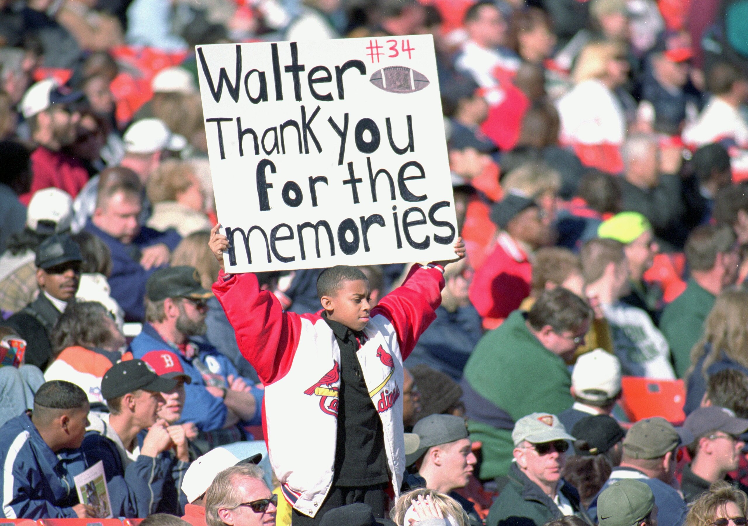 6 Nov 1999:  A young fan holds up a sign during Walter Payton's Memorial Service at Soldier Field in Chicago, Illinois. Mandatory Credit: Jonathan Daniel  /Allsport