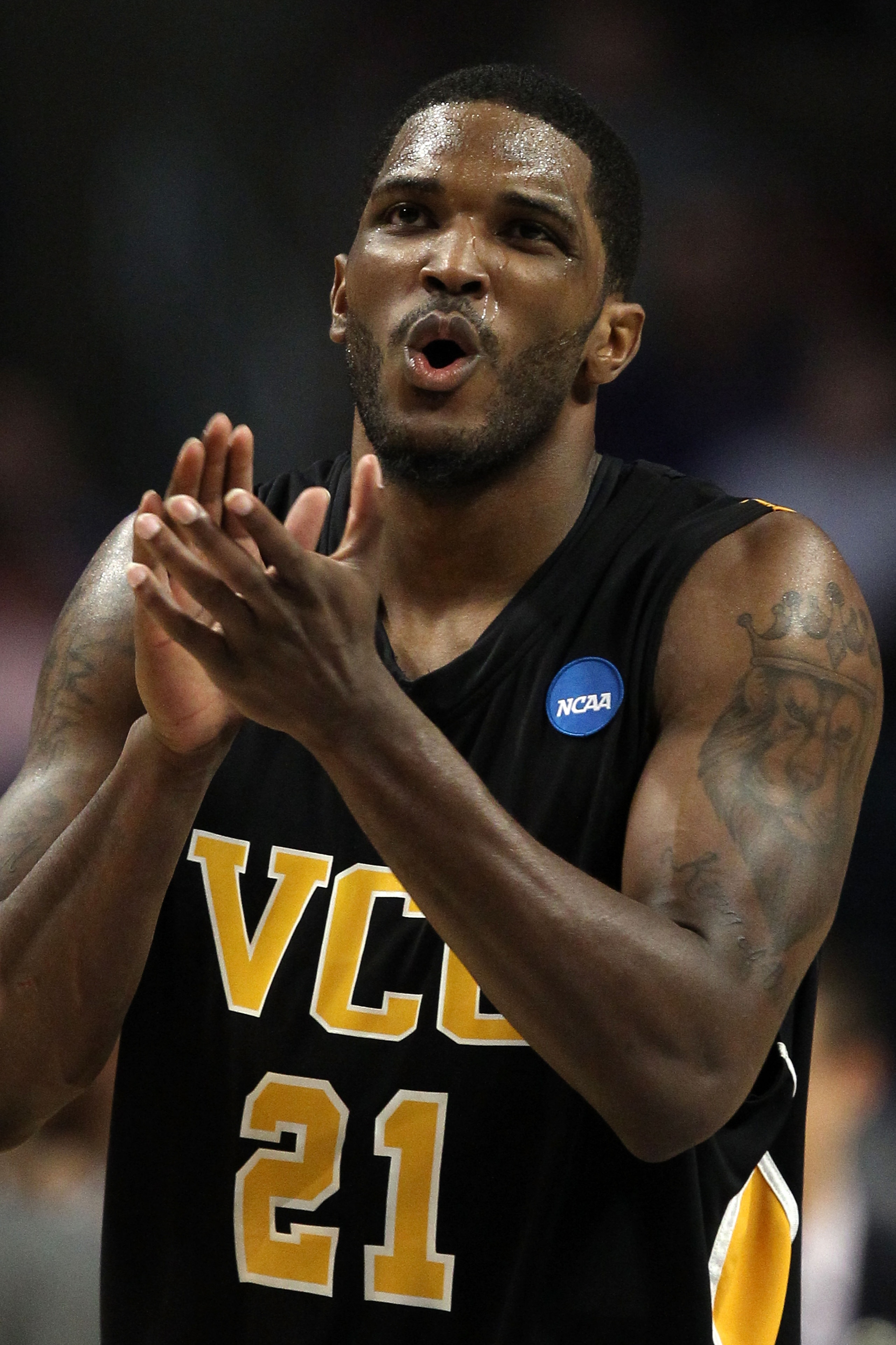 CHICAGO, IL - MARCH 18:  Jamie Skeen #21 of the Virginia Commonwealth Rams cheers in the second half of the game against the Georgetown Hoyas during the second round of the 2011 NCAA men's basketball tournament at the United Center on March 18, 2011 in Ch