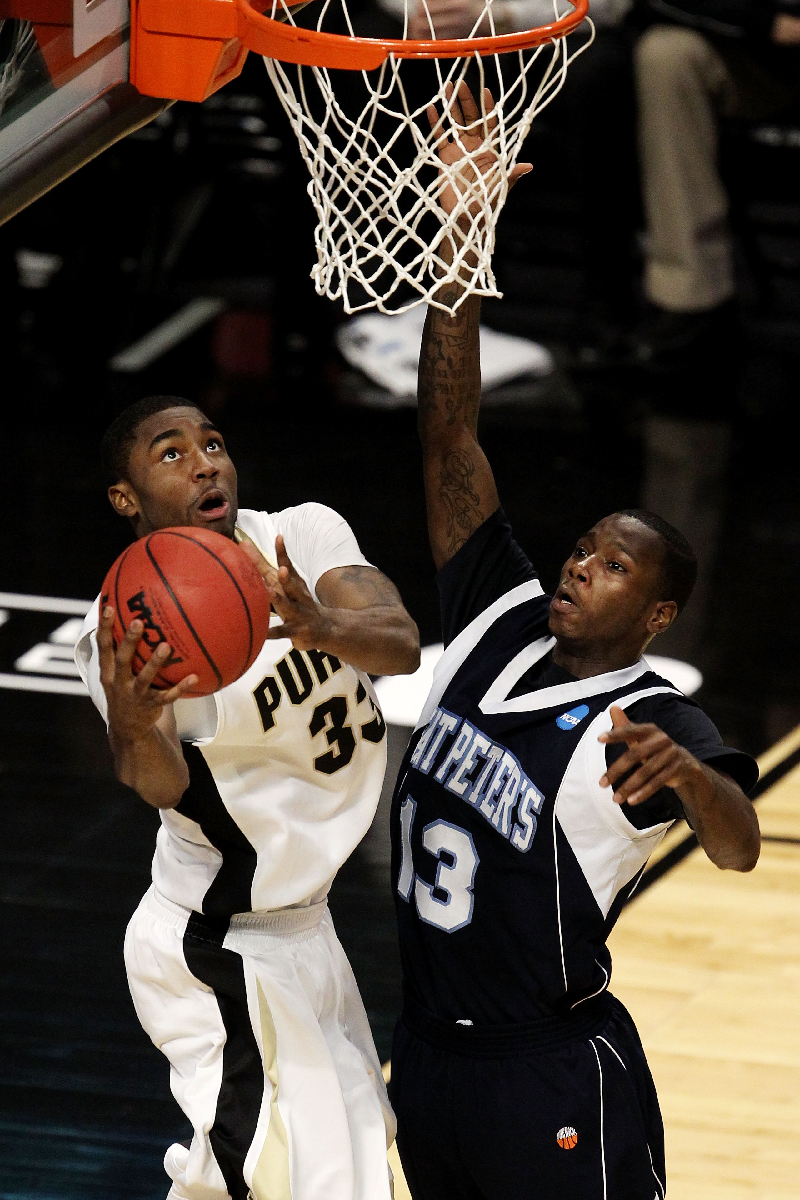 CHICAGO, IL - MARCH 18:  E'Twaun Moore #33 of the Purdue Boilermakers shoots against Steven Samuels #13 of the St. Peter's Peacocks in the second half during the second round of the 2011 NCAA men's basketball tournament at the United Center on March 18, 2