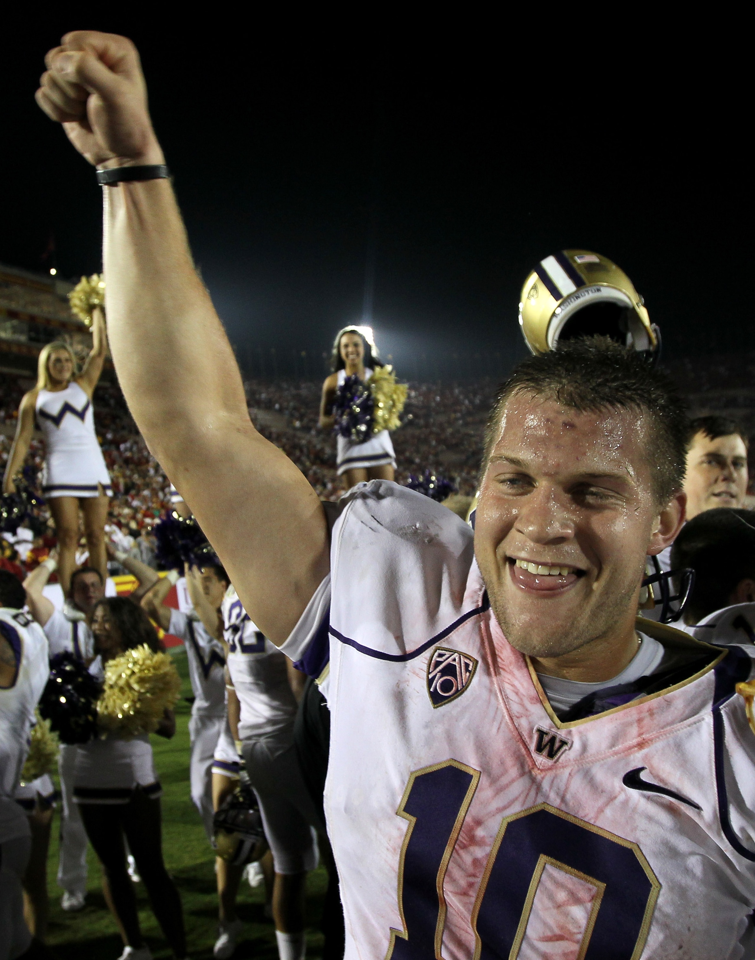 LOS ANGELES - OCTOBER 2:  Quarterback Jake Locker #10 of the Washington Huskies celebrates after the game with the USC Trojans at the Los Angeles Memorial Coliseum on October 2, 2010 in Los Angeles, California.  Washington won 32-31.   (Photo by Stephen D
