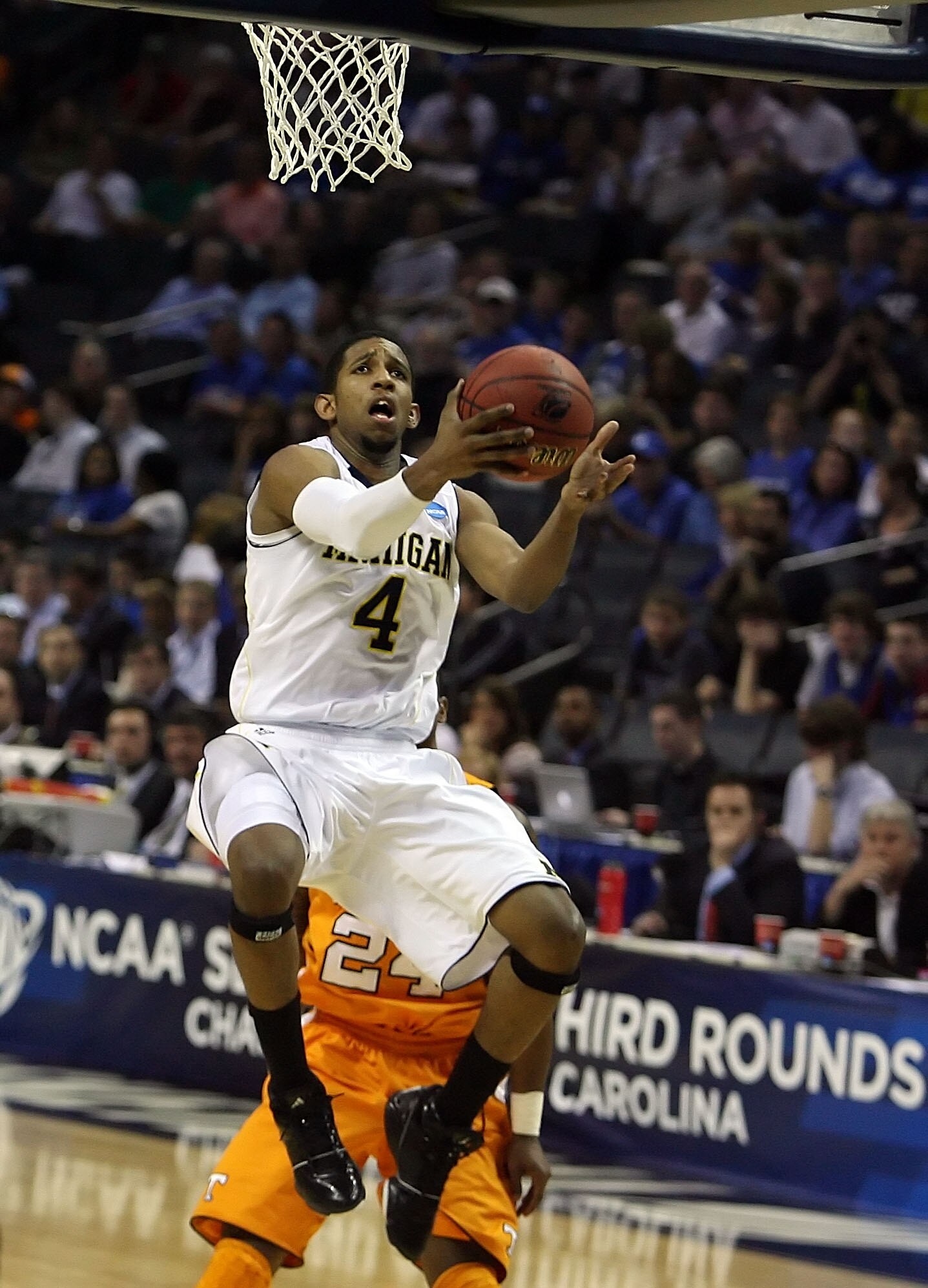 CHARLOTTE, NC - MARCH 18:  Darius Morris #4 of the Michigan Wolverines lays the ball up in the second half while taking on the Tennessee Volunteers during the second round of the 2011 NCAA men's basketball tournament at Time Warner Cable Arena on March 18
