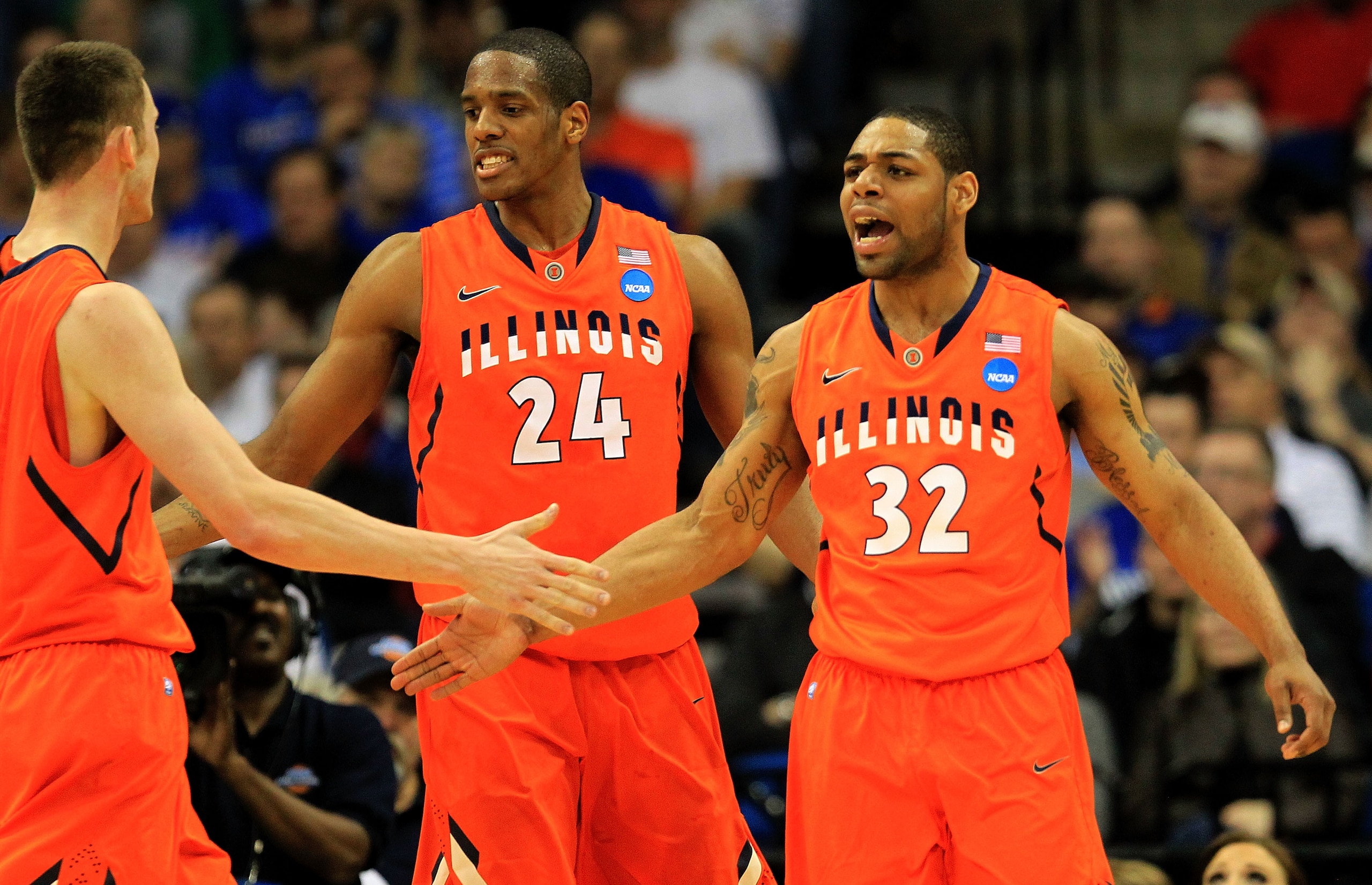 TULSA, OK - MARCH 18:  Demetri McCamey #32 and Mike Davis #24 of the Illinois Fighting Illini celebrate after a play against the UNLV Rebels during the second round of the 2011 NCAA men's basketball tournament at BOK Center on March 18, 2011 in Tulsa, Okl