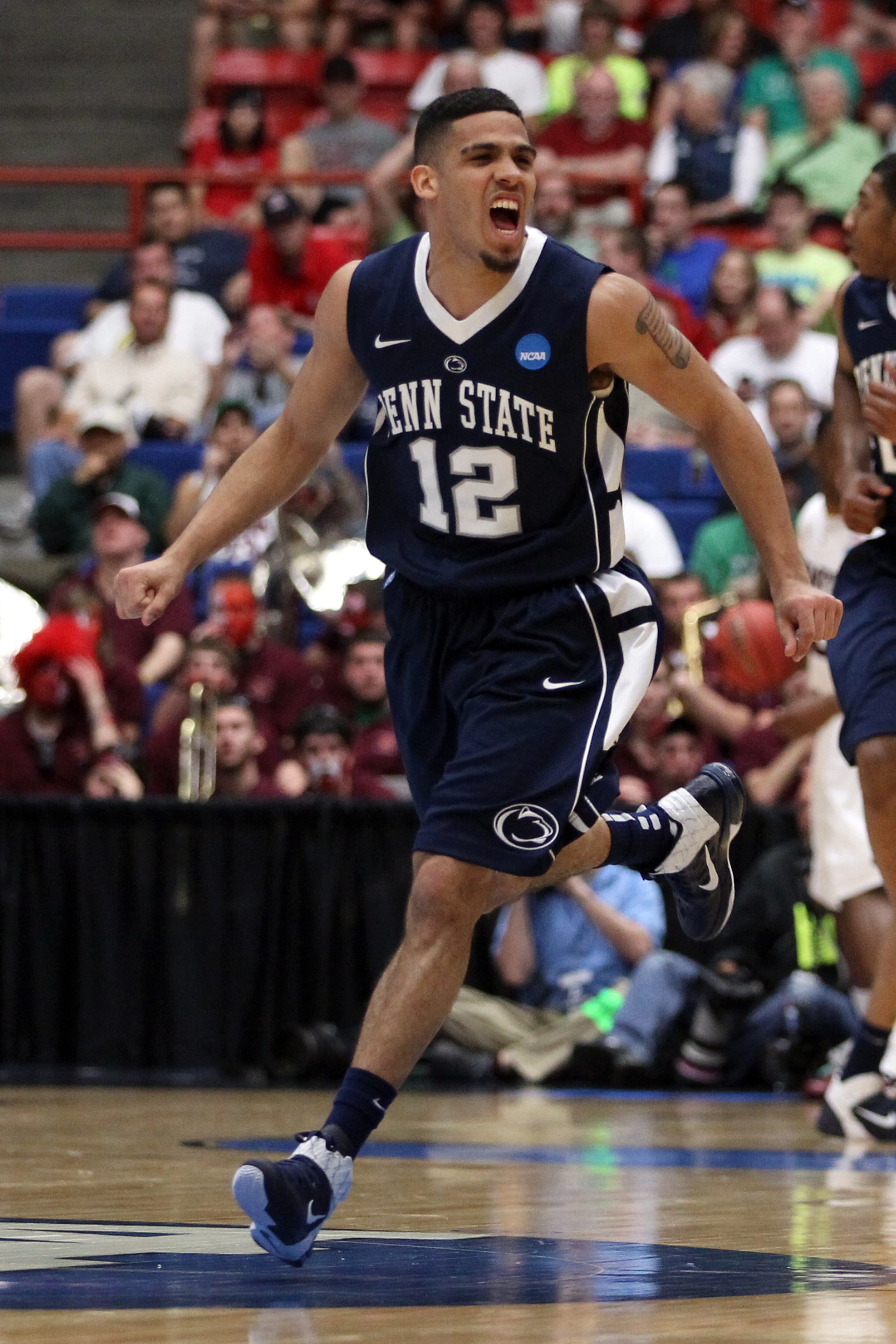 TUCSON, AZ - MARCH 17:  Talor Battle #12 of the Penn State Nittany Lions celebrates after scoring a three-pointer against the Temple Owls during the second round of the 2011 NCAA men's basketball tournament at McKale Center on March 17, 2011 in Tucson, Ar