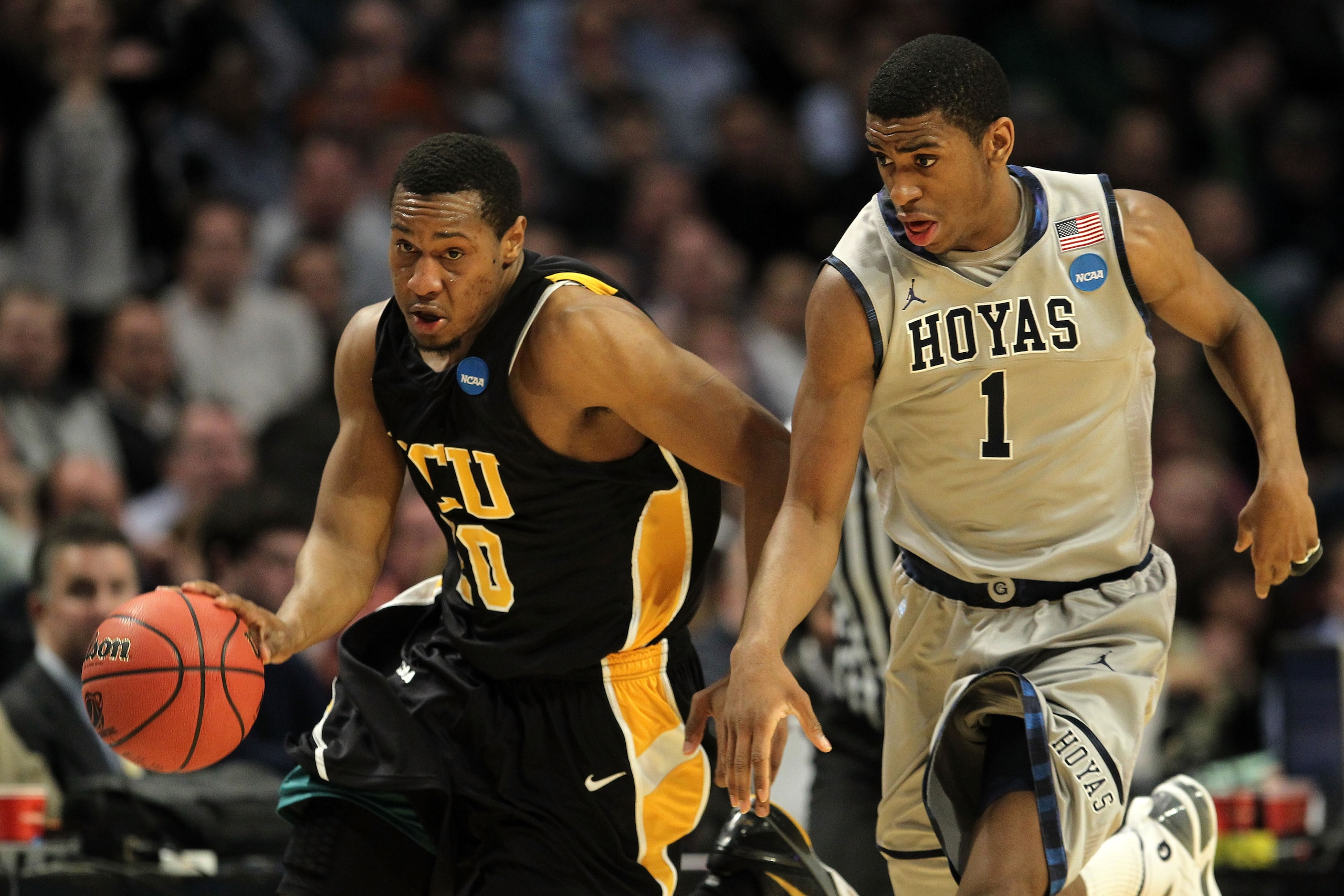 CHICAGO, IL - MARCH 18: Bradford Burgess #20 of the Virginia Commonwealth Rams drives against Hollis Thompson #1 of the Georgetown Hoyas in the first half during the second round of the 2011 NCAA men's basketball tournament at the United Center on March CHICAGO, IL - MARCH 18: Bradford Burgess #20 of the Virginia Commonwealth Rams drives against Hollis Thompson #1 of the Georgetown Hoyas in the first half during the second round of the 2011 NCAA men's basketball tournament at the United Center on March