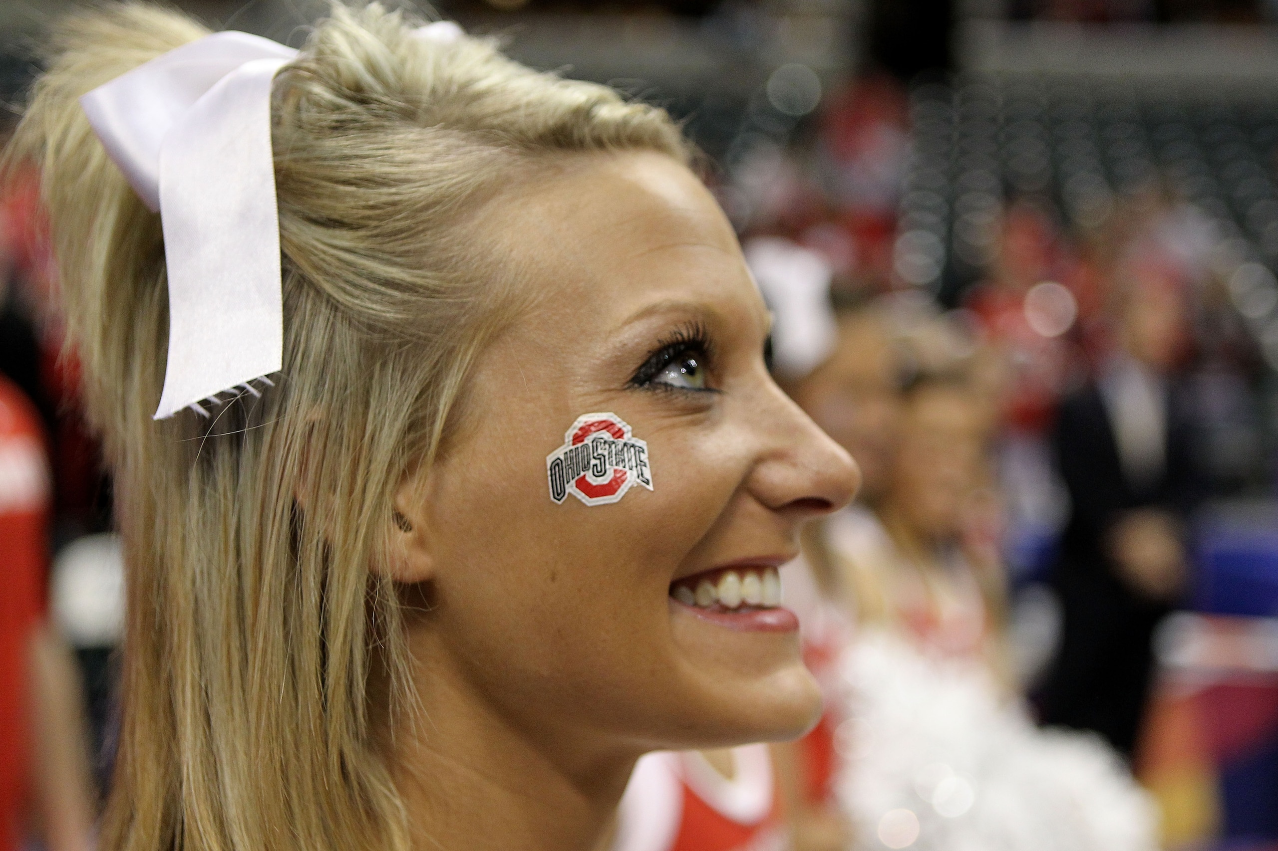 INDIANAPOLIS, IN - MARCH 13:  A cheerleader from the Ohio State Buckeyes celebrates after Ohio State won 71-60 against the Penn State Nittany Lions during the championship game of the 2011 Big Ten Men's Basketball Tournament at Conseco Fieldhouse on March