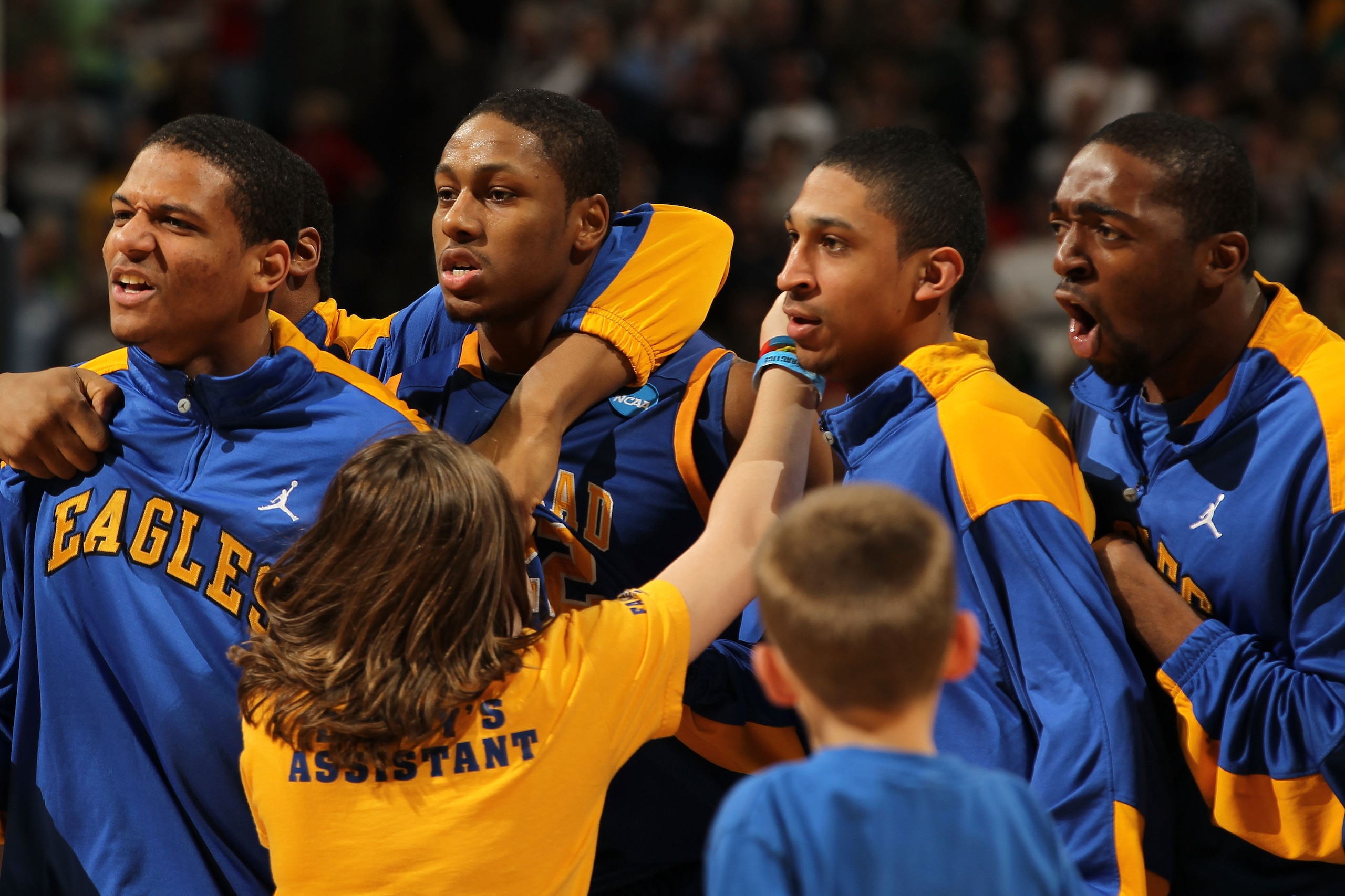 DENVER, CO - MARCH 17:  The Morehead State Eagles celebrate after defeating the Louisville Cardinals during the second round of the 2011 NCAA men's basketball tournament at Pepsi Center on March 17, 2011 in Denver, Colorado. The Morehead State Eagles defe
