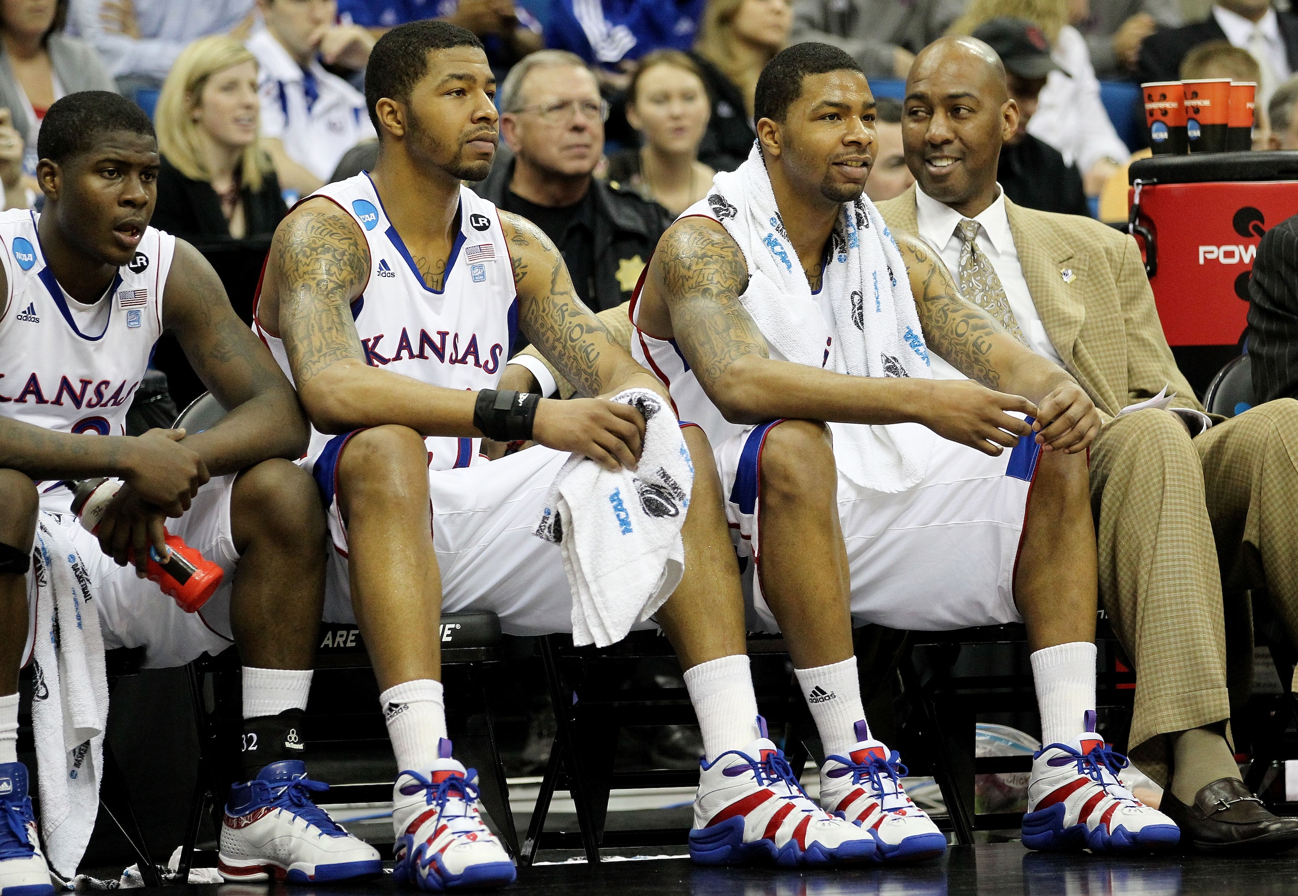 TULSA, OK - MARCH 18:  (2nd and 3rd from L) Markieff Morris #21 and Marcus Morris #22 of the Kansas Jayhawks sit on the bench during their second round game against the Boston University Terriers in the 2011 NCAA men's basketball tournament at BOK Center