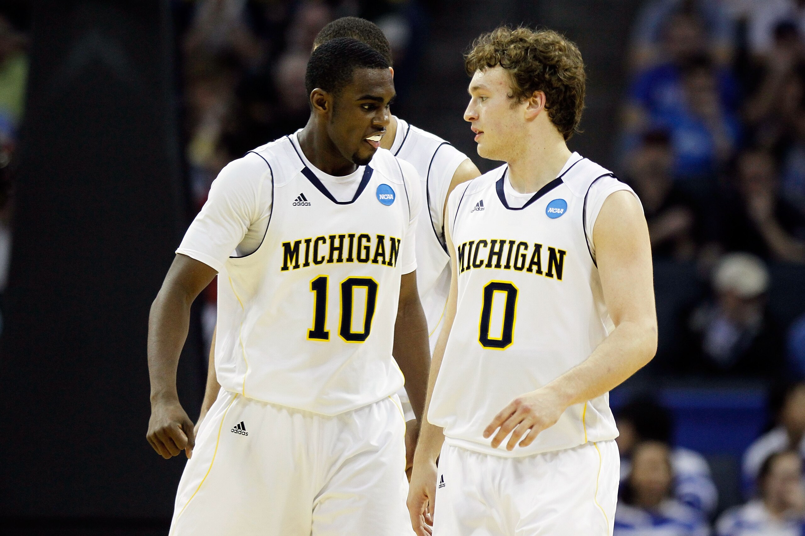CHARLOTTE, NC - MARCH 18:  Tim Hardaway Jr. #10 and Zack Novak #0 of the Michigan Wolverines react in the second half while taking on the Tennessee Volunteers during the second round of the 2011 NCAA men's basketball tournament at Time Warner Cable Arena