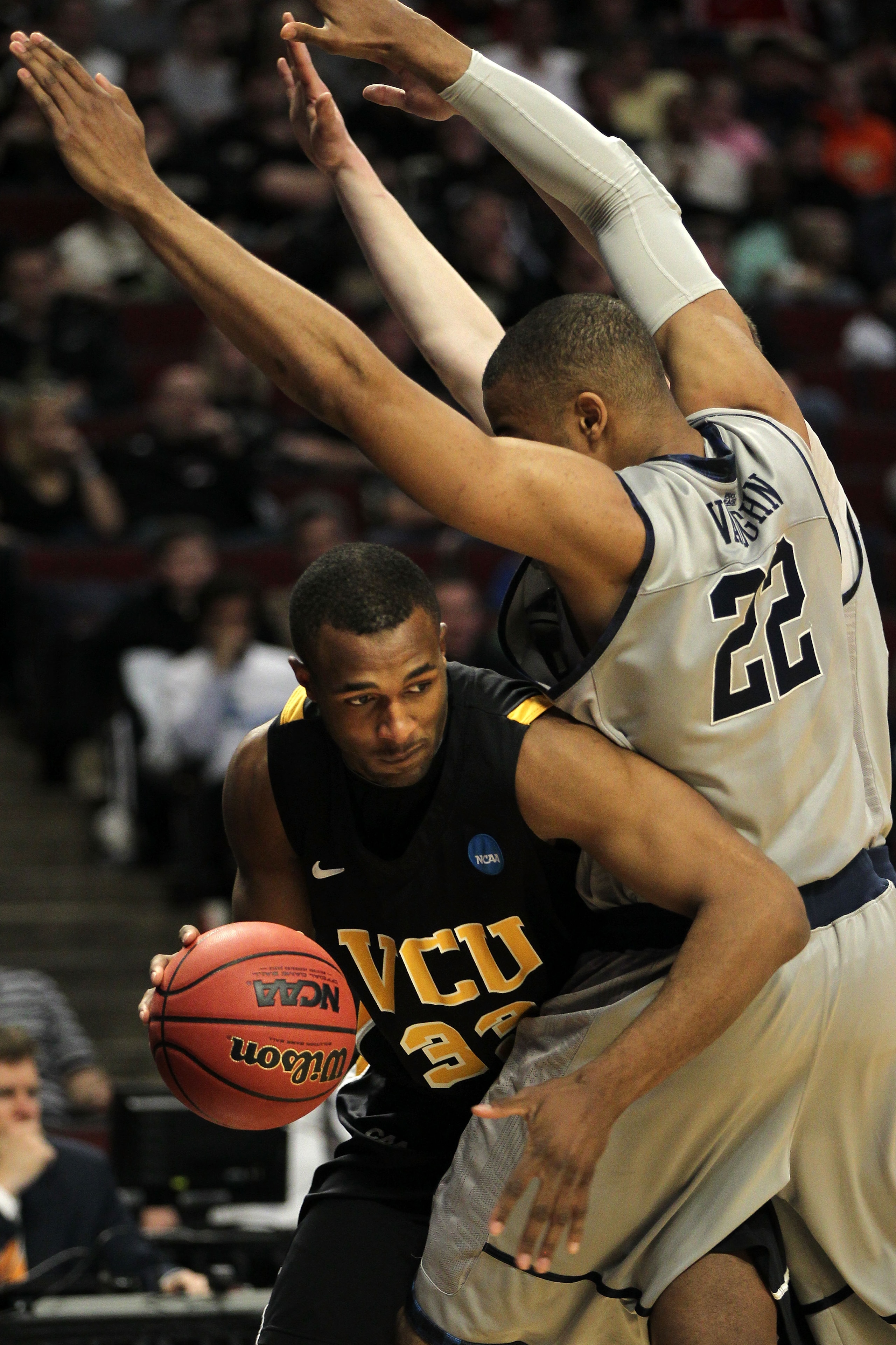 CHICAGO, IL - MARCH 18: D.J. Haley #33 of the Virginia Commonwealth Rams drives on Julian Vaughn #22 of the Georgetown Hoyas in the first half during the second round of the 2011 NCAA men's basketball tournament at the United Center on March 18, 2011 in CHICAGO, IL - MARCH 18: D.J. Haley #33 of the Virginia Commonwealth Rams drives on Julian Vaughn #22 of the Georgetown Hoyas in the first half during the second round of the 2011 NCAA men's basketball tournament at the United Center on March 18, 2011 in
