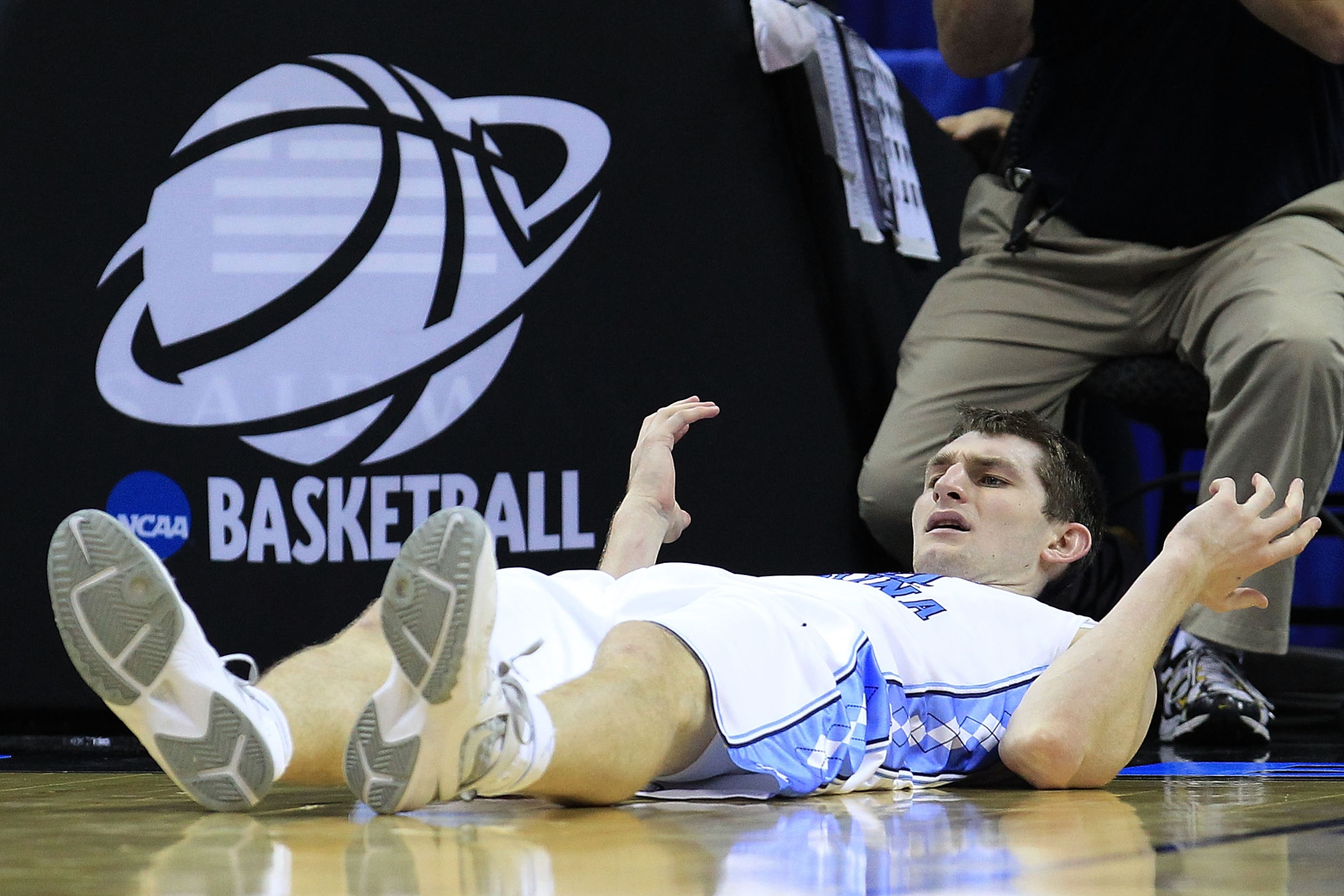 CHARLOTTE, NC - MARCH 18:  Tyler Zeller #44 of the North Carolina Tar Heels reacts as he lays on his back in the second half while taking on the Long Island Blackbirds during the second round of the 2011 NCAA men's basketball tournament at Time Warner Cab
