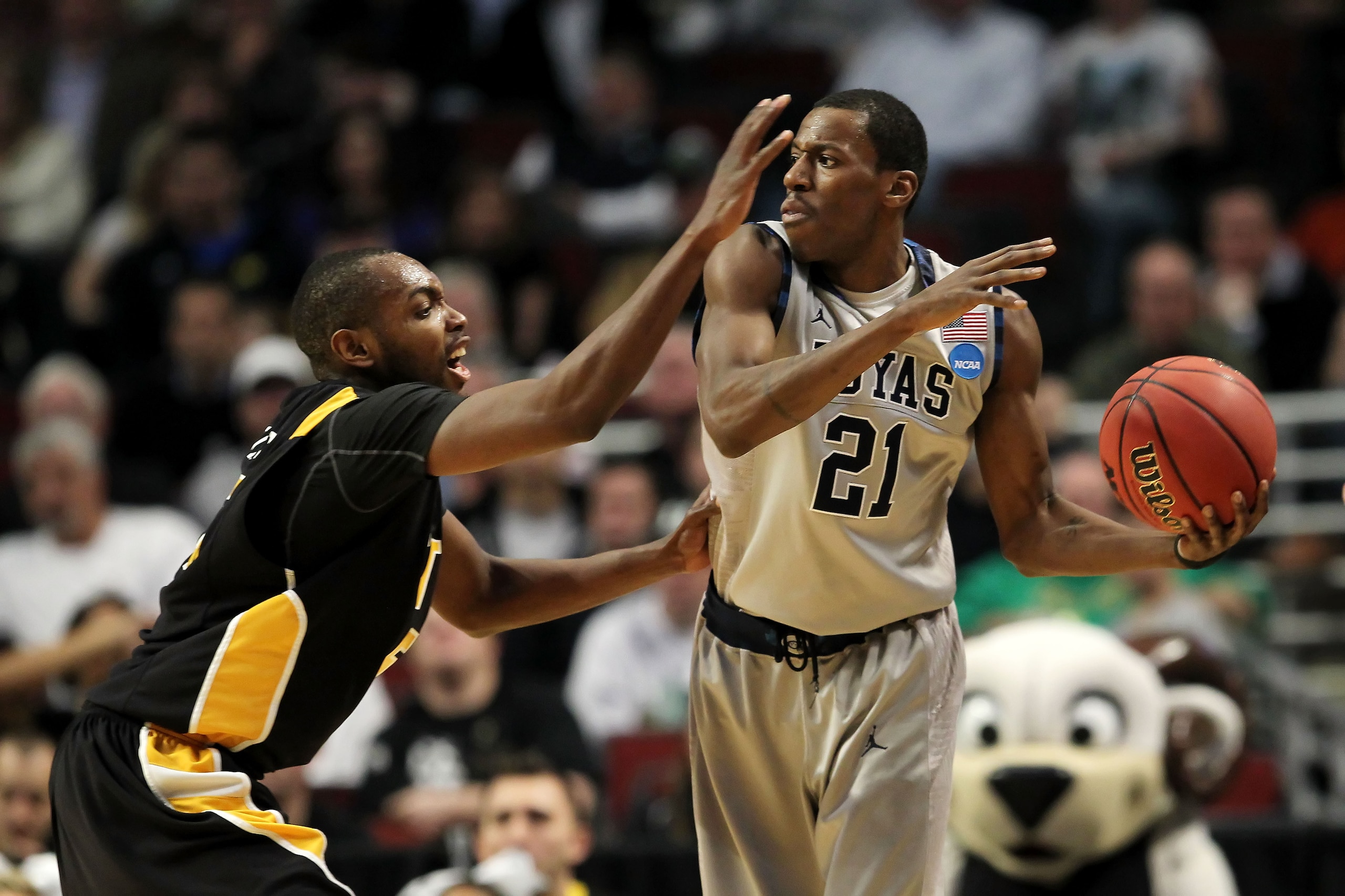 CHICAGO, IL - MARCH 18: Jason Clark #21 of the Georgetown Hoyas looks to pass against Ed Nixon #50 of the Virginia Commonwealth Rams in the first half during the second round of the 2011 NCAA men's basketball tournament at the United Center on March 18, CHICAGO, IL - MARCH 18: Jason Clark #21 of the Georgetown Hoyas looks to pass against Ed Nixon #50 of the Virginia Commonwealth Rams in the first half during the second round of the 2011 NCAA men's basketball tournament at the United Center on March 18,