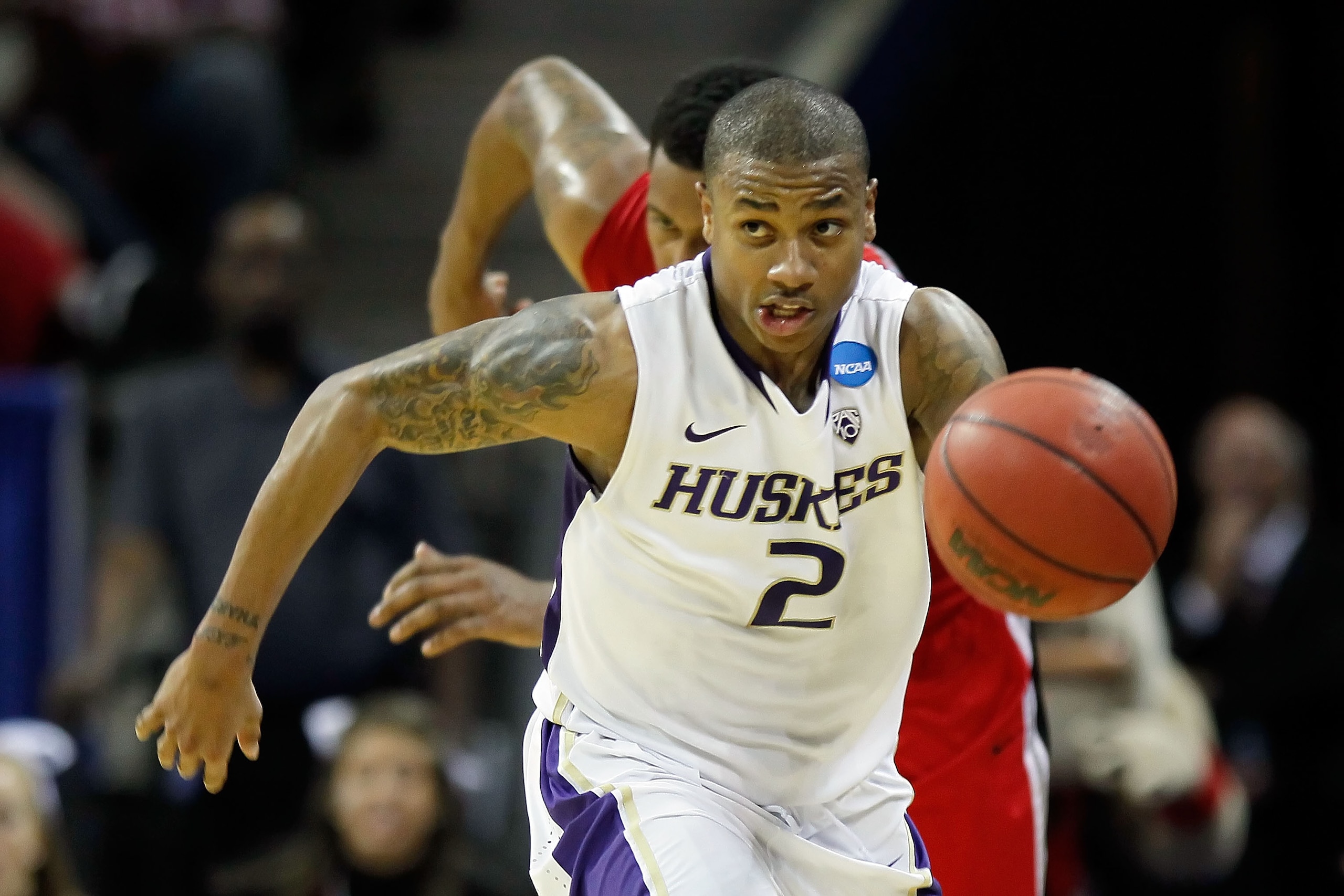 CHARLOTTE, NC - MARCH 18:  Isaiah Thomas #2 of the Washington Huskies moves the ball upcourt while taking on the Georgia Bulldogs during the second round of the 2011 NCAA men's basketball tournament at Time Warner Cable Arena on March 18, 2011 in Charlott