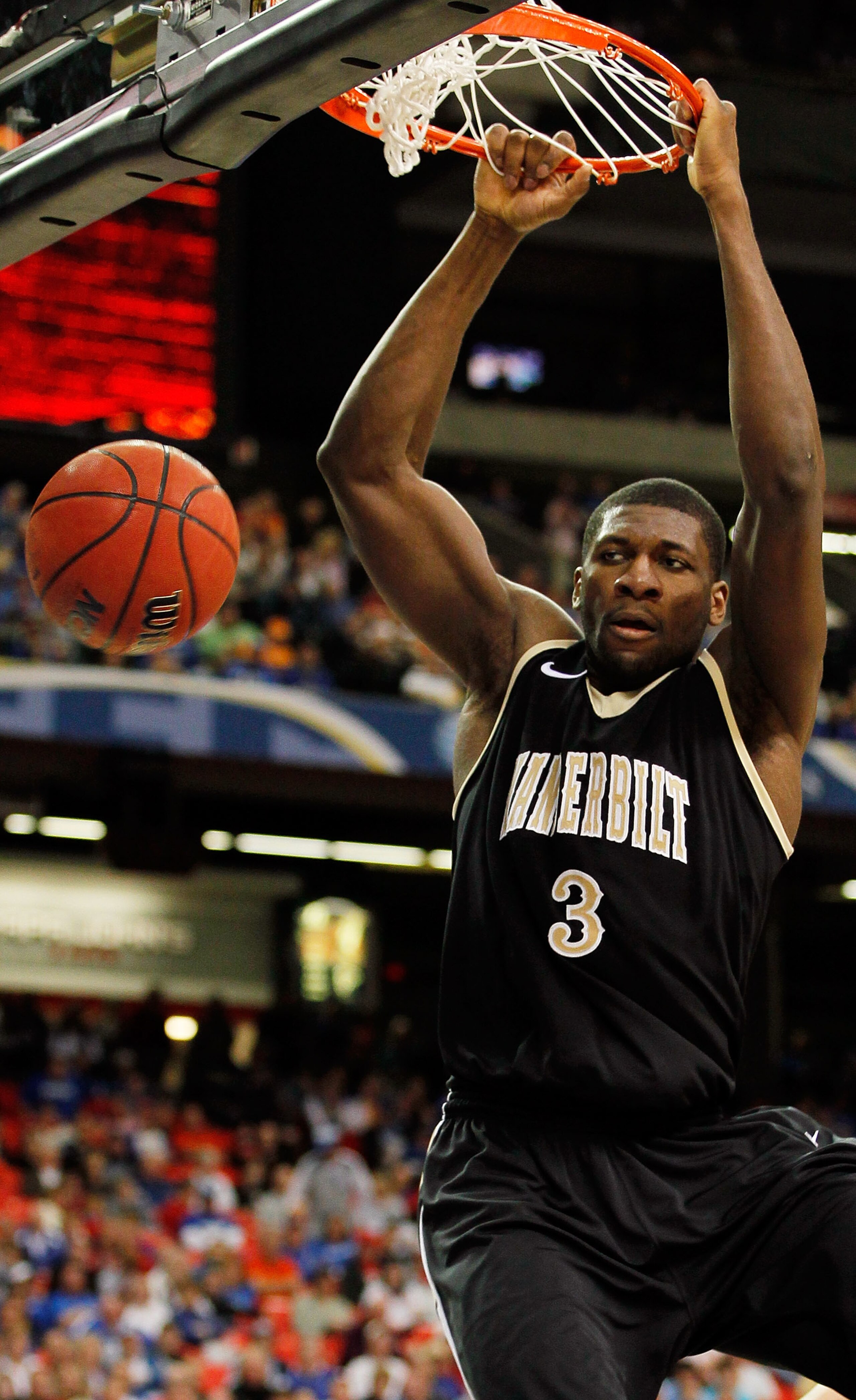 ATLANTA, GA - MARCH 12:  Festus Ezeli #3 of the Vanderbilt Commodores dunks on the Florida Gators during the semifinals of the SEC Men's Basketball Tournament at Georgia Dome on March 12, 2011 in Atlanta, Georgia.  (Photo by Kevin C. Cox/Getty Images)